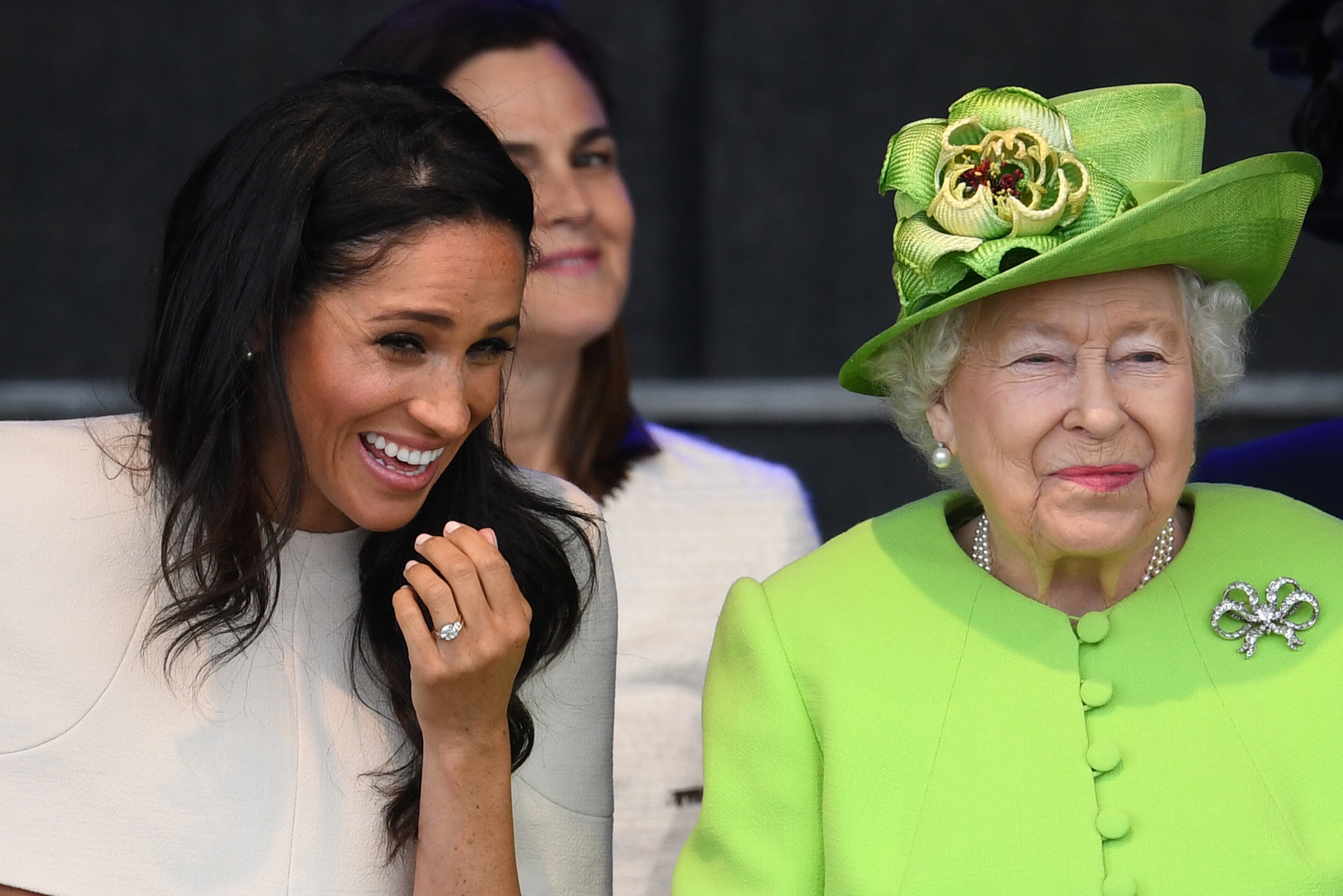 WIDNES, ENGLAND - JUNE 14: Queen Elizabeth II sits and laughs with Meghan, Duchess of Sussex during a ceremony to open the new Mersey Gateway Bridge on June 14, 2018 in the town of Widnes in Halton, Cheshire, England. Meghan Markle married Prince Harry last month to become The Duchess of Sussex and this is her first engagement with the Queen. During the visit the pair will open a road bridge in Widnes and visit The Storyhouse and Town Hall in Chester. (Photo by Jeff J Mitchell/Getty Images)