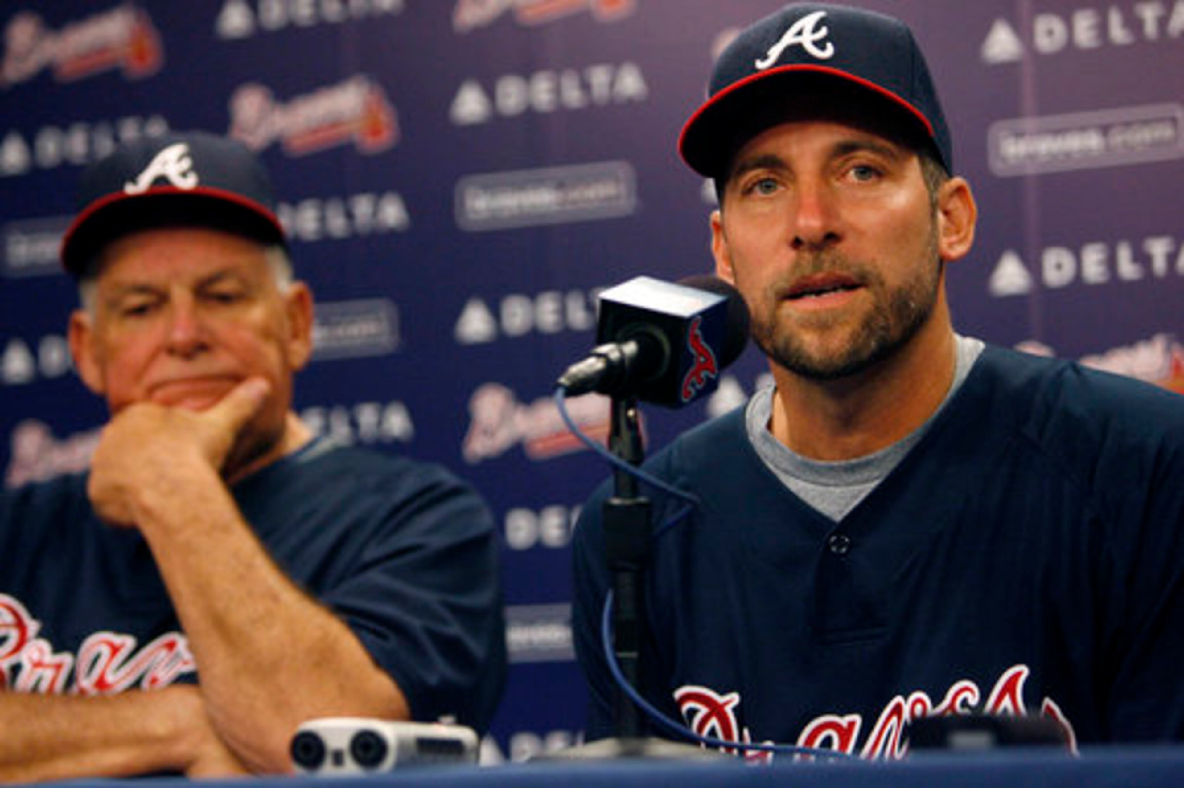 On Wednesday Braves pitcher John Smoltz announces he'll have season-ending shoulder surgery as manager Bobby Cox listens before their game against the Marlins in Atlanta.