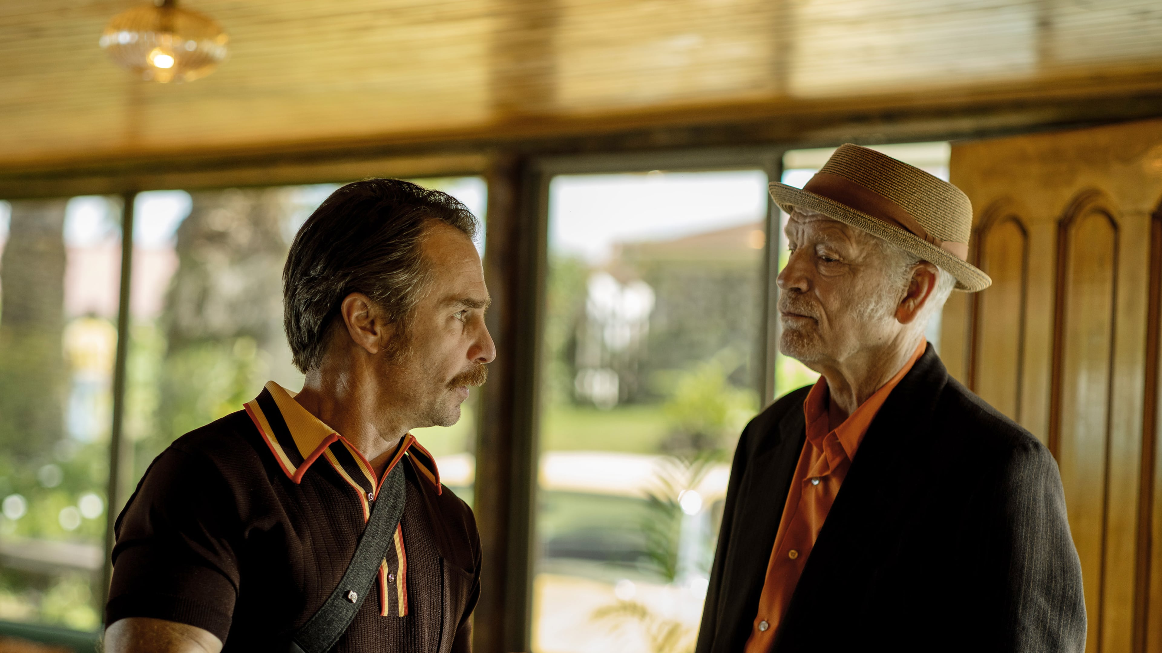 This image released by Searchlight Pictures shows Sam Rockwell, left, and John Malkovich in a scene from "Wild Horse Nine." (Diego Araya Corvalán/Searchlight Pictures via AP)