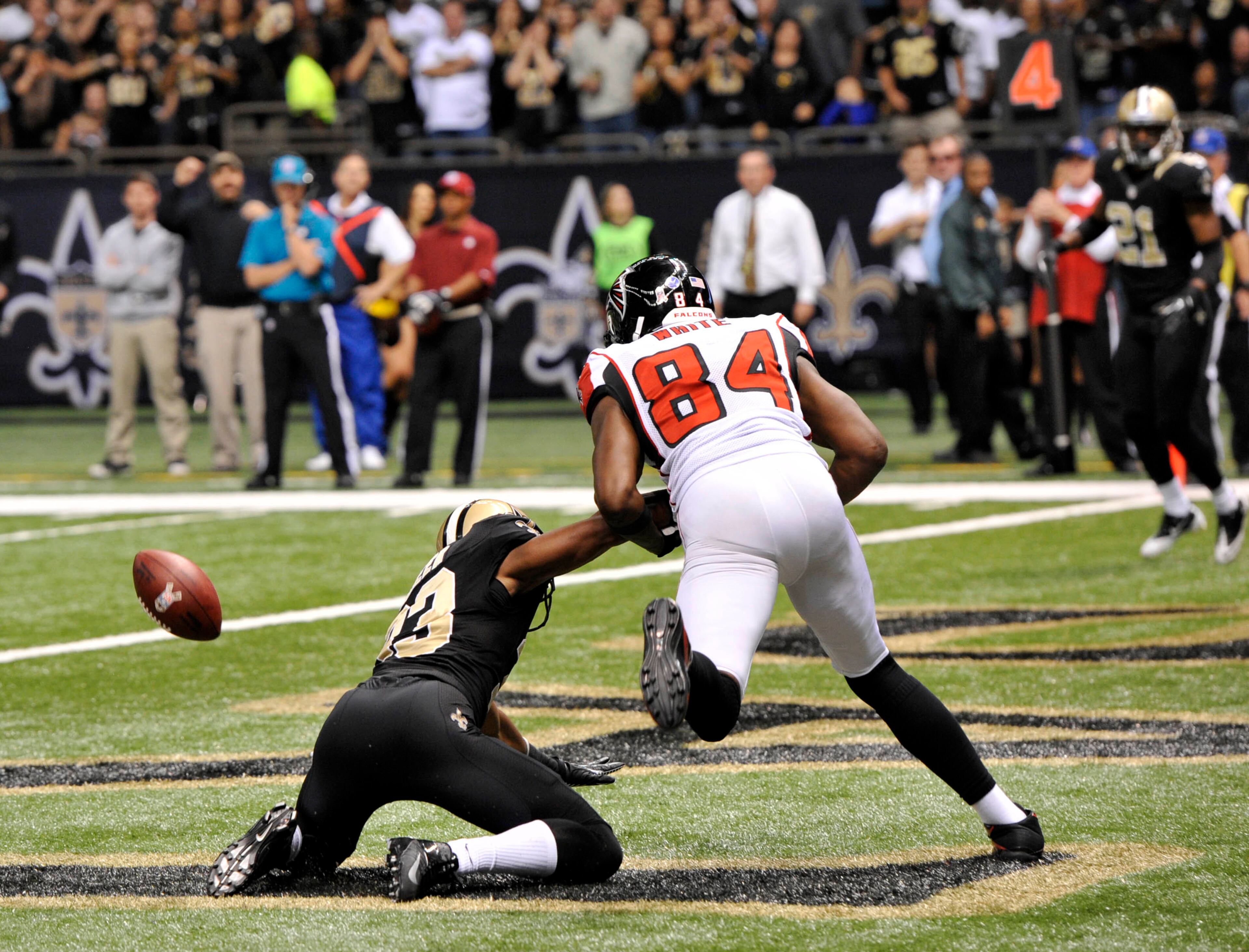 New Orleans Saints cornerback Jabari Greer (33) breaks up a pass in the end zone intended for Atlanta Falcons wide receiver Roddy White (84) on fourth down, ending the Atlanta Falcons hope for a win, in the second half an NFL football game at the Mercedes-Benz Superdome in New Orleans, Sunday, Nov. 11, 2012. The Saint won 31-27. (AP Photo/Bill Feig)