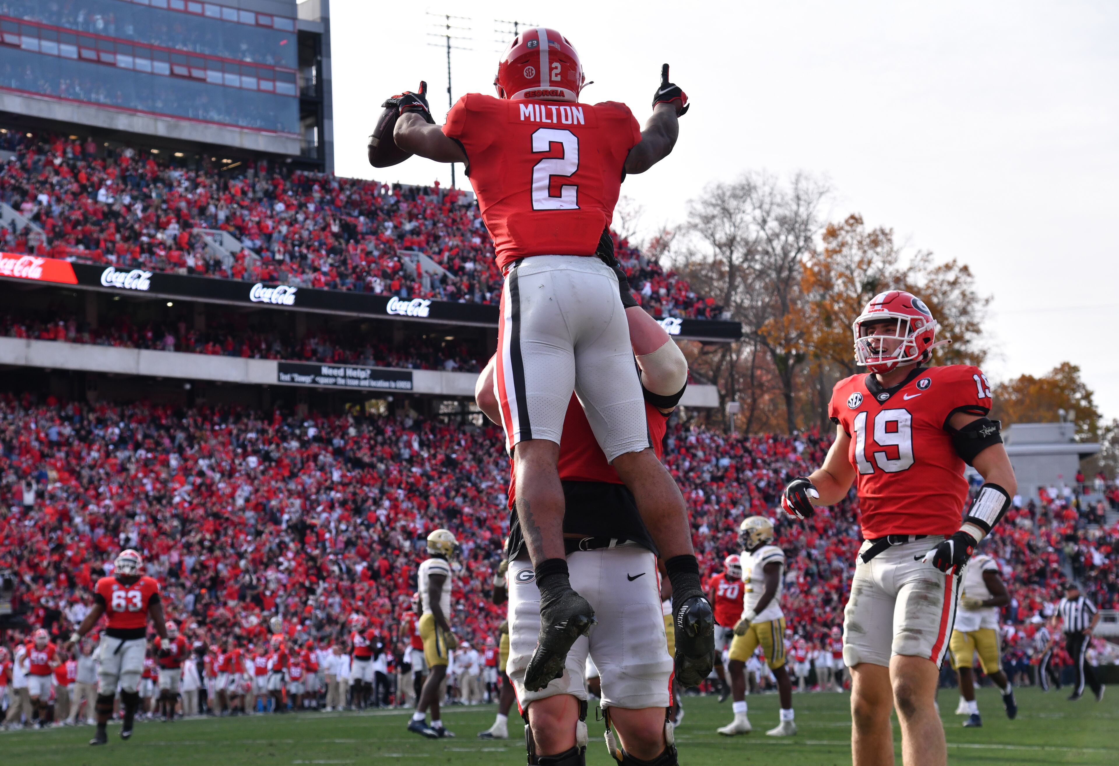 Georgia's running back Kendall Milton (2) celebrates with teammates after scoring a touchdown during the second half in an NCAA football game at Sanford Stadium in Athens on Saturday, November 26, 2022. Georgia won 37-14 over Georgia Tech. (Hyosub Shin / Hyosub.Shin@ajc.com)