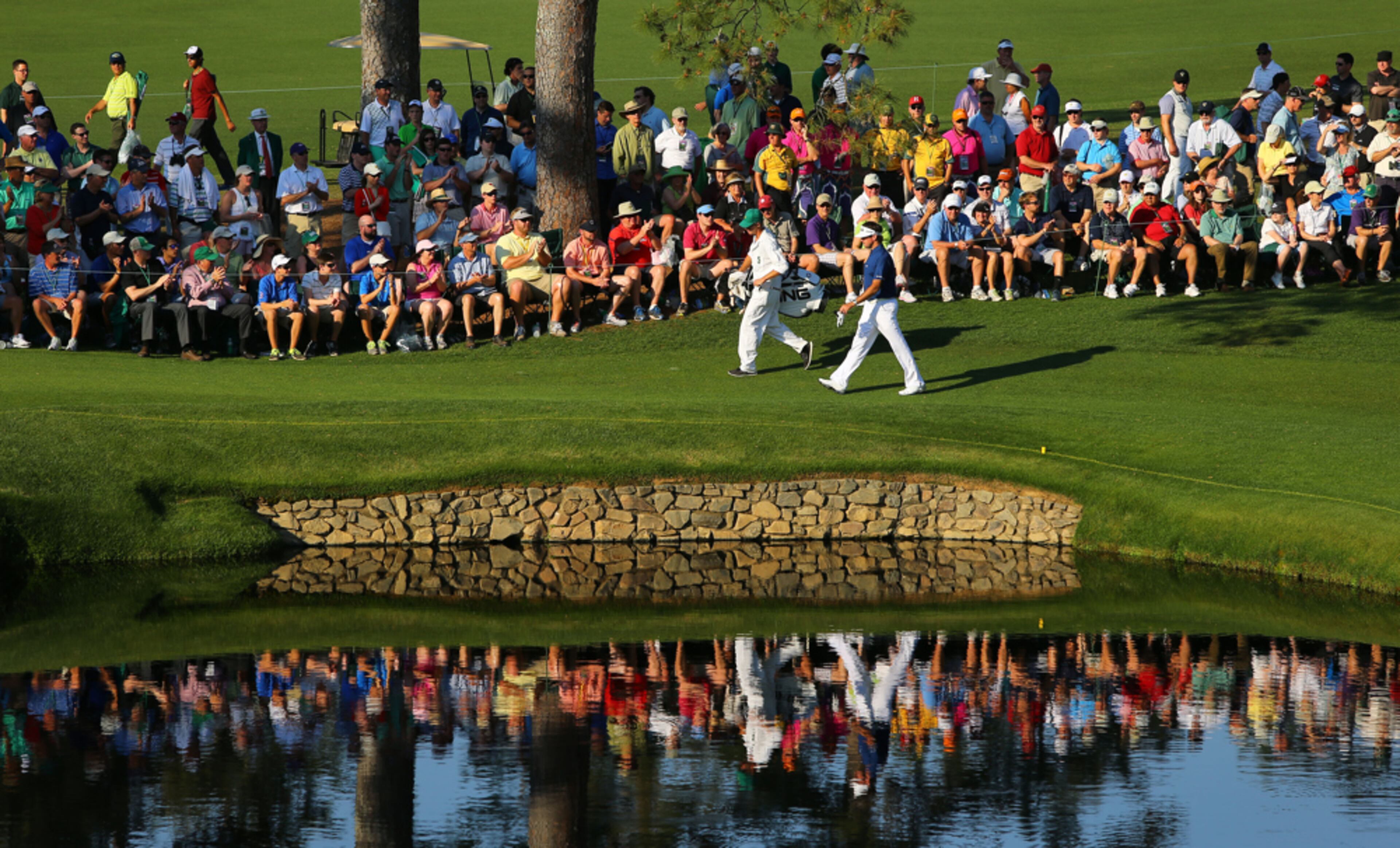 A WALK IN THE PARK--APRIL 12, 2014 AUGUSTA Bubba Watson and his caddie, Ted Scott, walk around the pond on #15. Third round photos from the Masters Golf Tournament, Saturday, April 12, 2014. CURTIS COMPTON / CCOMPTON@AJC.COM