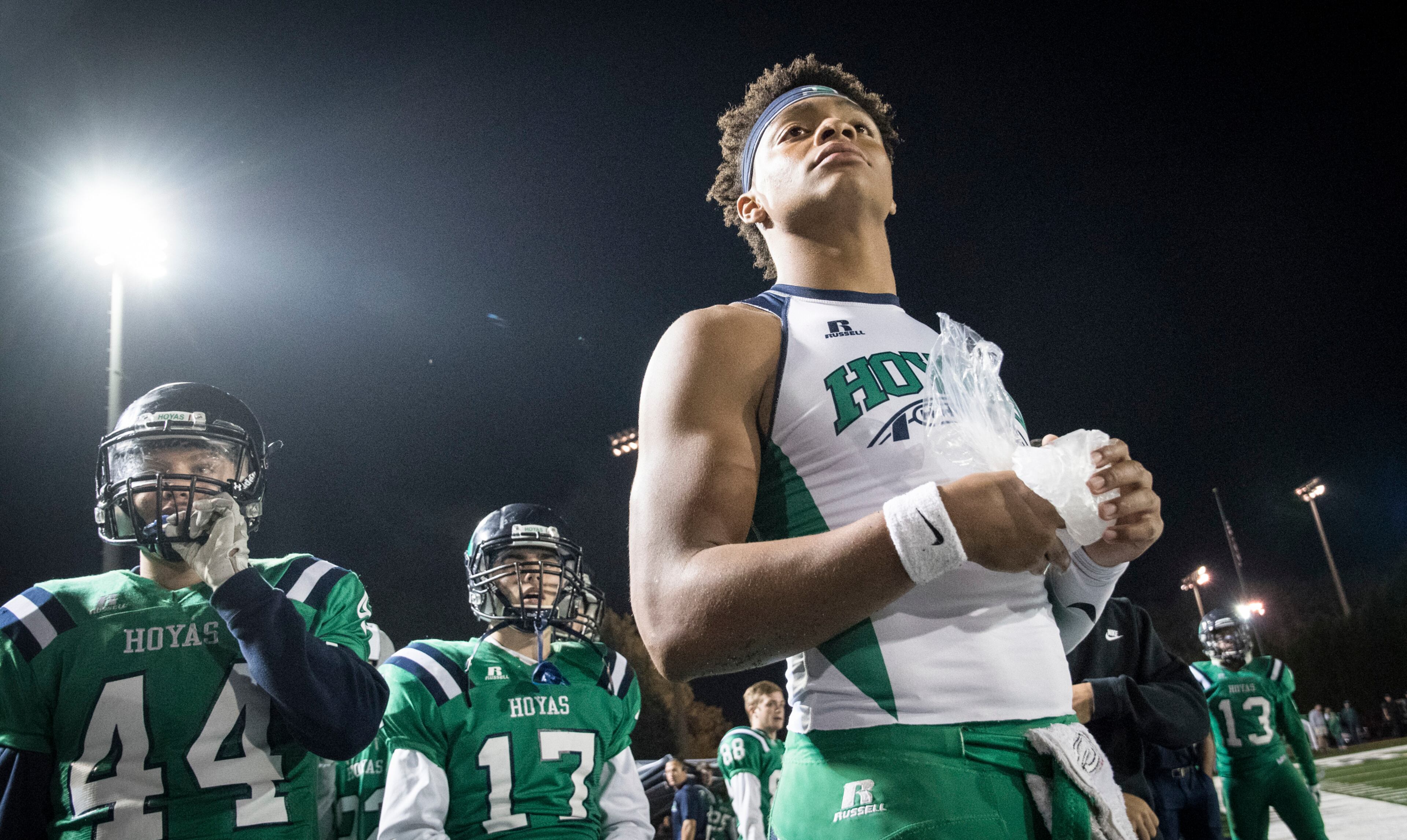 Harrison quarterback Justin Fields holds ice on his hand as he watches from the sideline after coming out of the football game against Dalton during the second half on Thursday, Oct. 19, 2017, in Kennesaw, Ga. (Special to the Atlanta Journal-Constitution, John Amis )