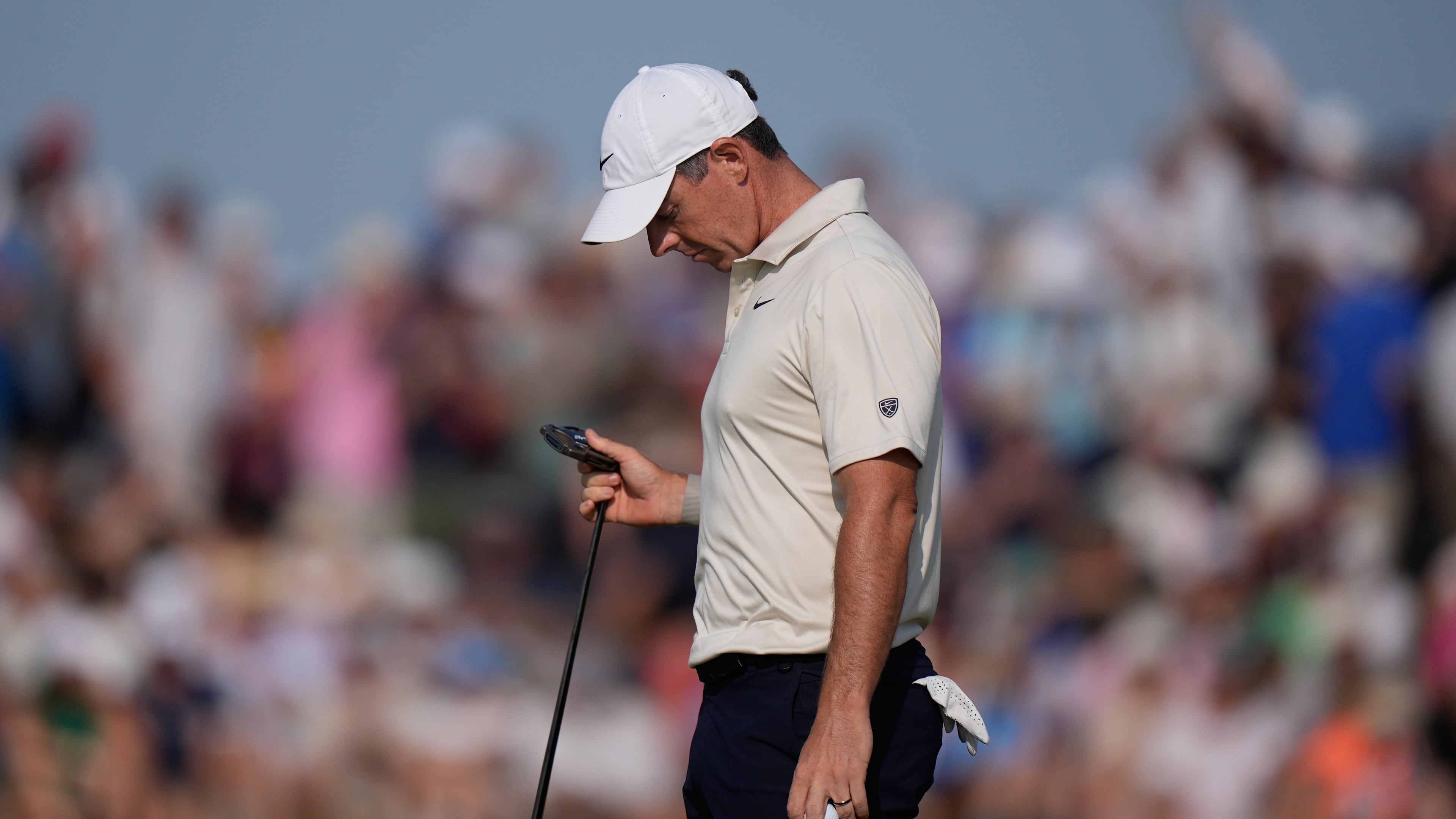 Rory McIlroy of Northern Ireland looks at his club after putting on the 9th green during the first day of the British Open Golf championships at Royal Birkdale golf club, in Southport, England, Thursday, July 16, 2026. (AP Photo/David Goldman)