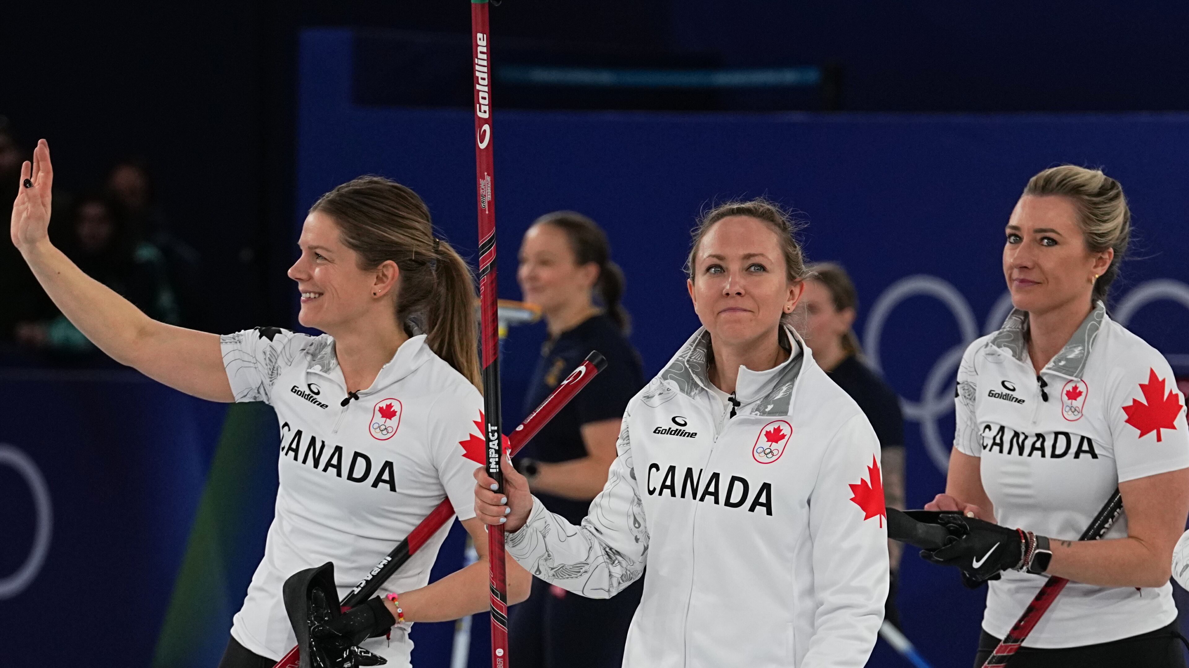 Canada's Rachel Homan, Sarah Wilkes and Emma Miskew react after the women's curling round robin session against China at the 2026 Winter Olympics, in Cortina d'Ampezzo, Italy, Monday, Feb. 16, 2026. (AP Photo/Fatima Shbair)