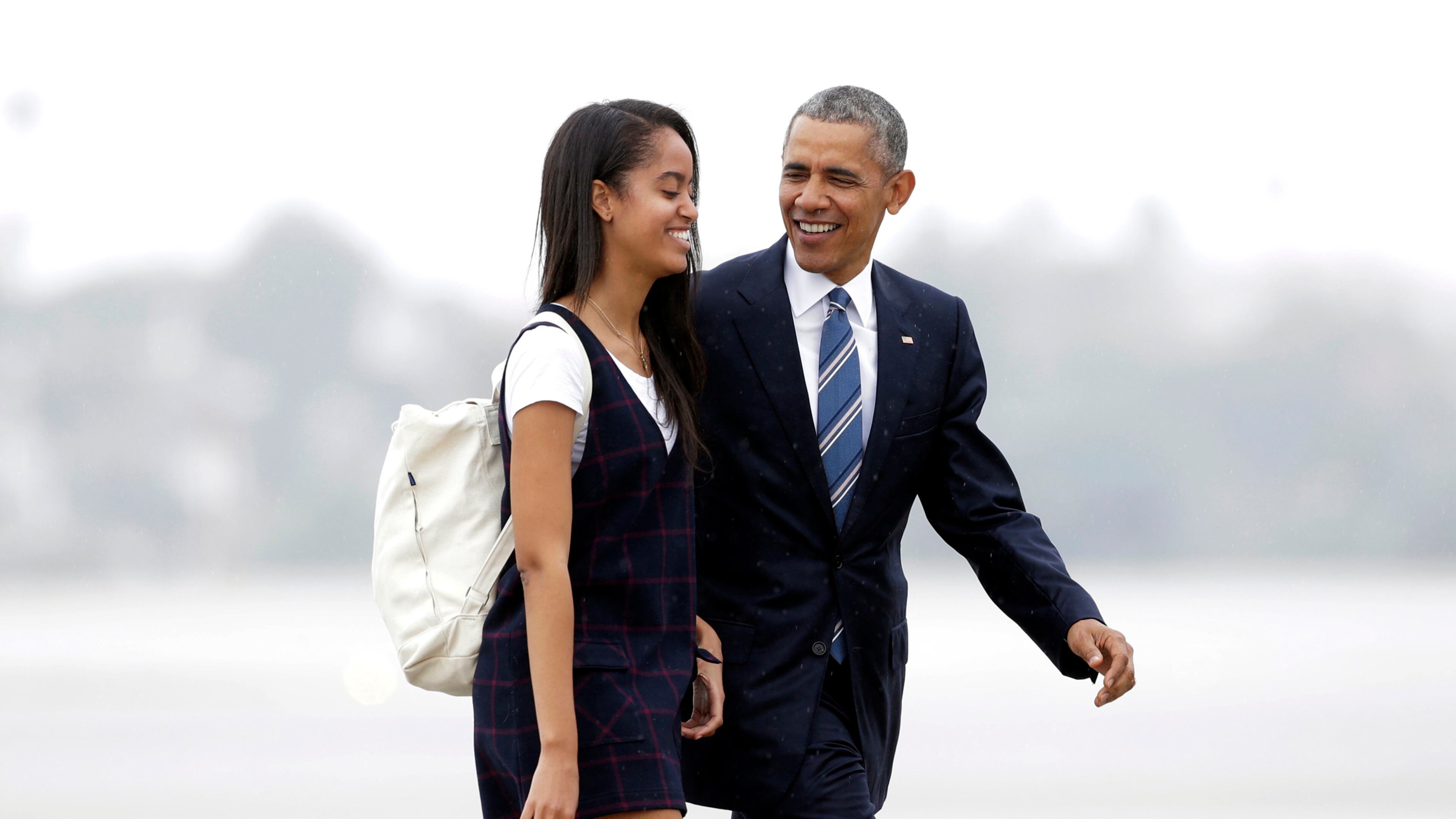 FILE- In this April 8, 2016, file photo, President Barack Obama and his daughter Malia walk from Marine One toward Air Force One at Los Angeles International Airport. Malia is taking a year off after graduating from high school before attending Harvard University as part of an expanding program for students known as a "gap year." (AP Photo/Nick Ut, File)