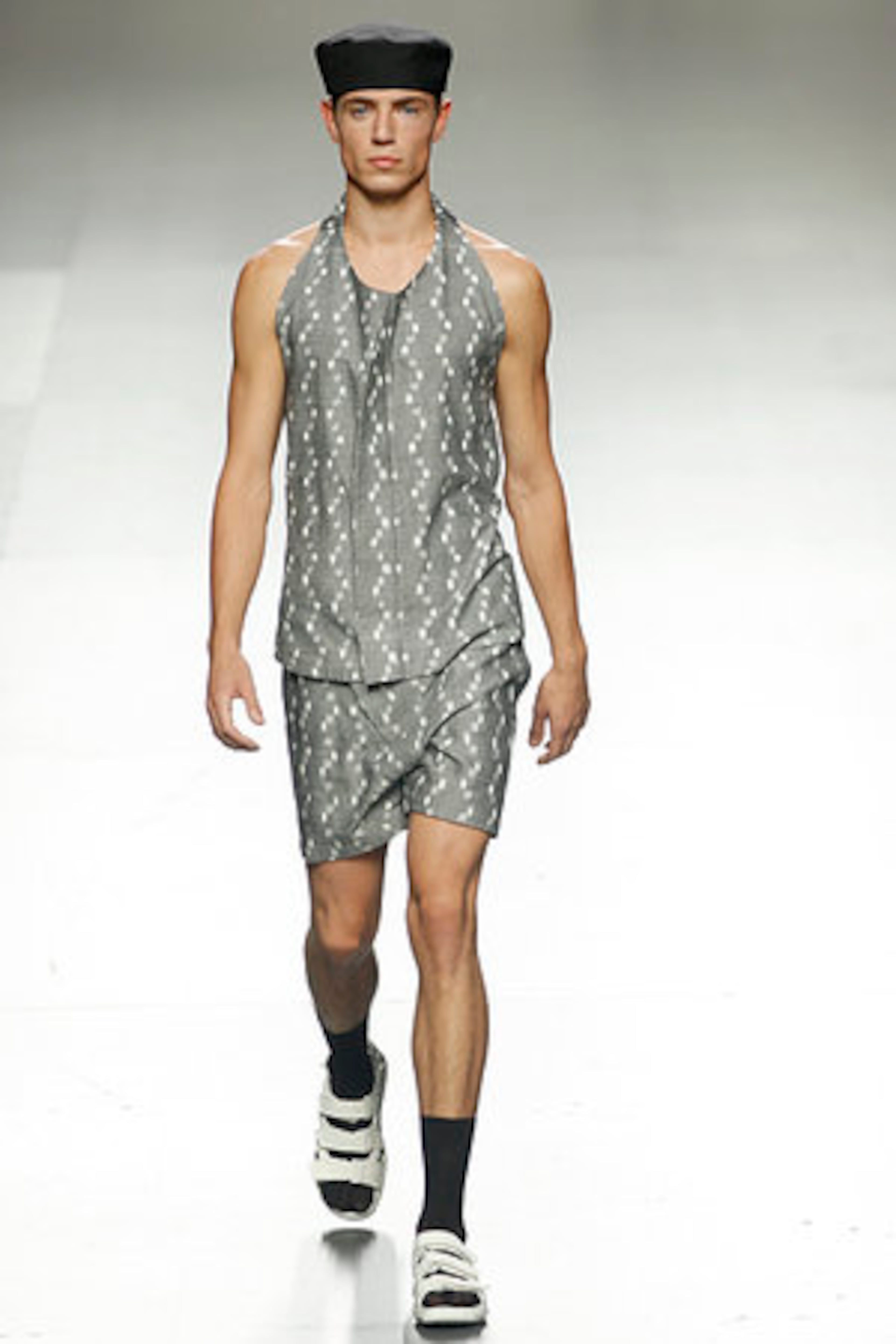 A model displays an Spring/Summer design by Alberto Puras during the Ego for young designers at the Pasarela Cibeles fashion show, in Madrid, Tuesday, Sept. 20, 2011.