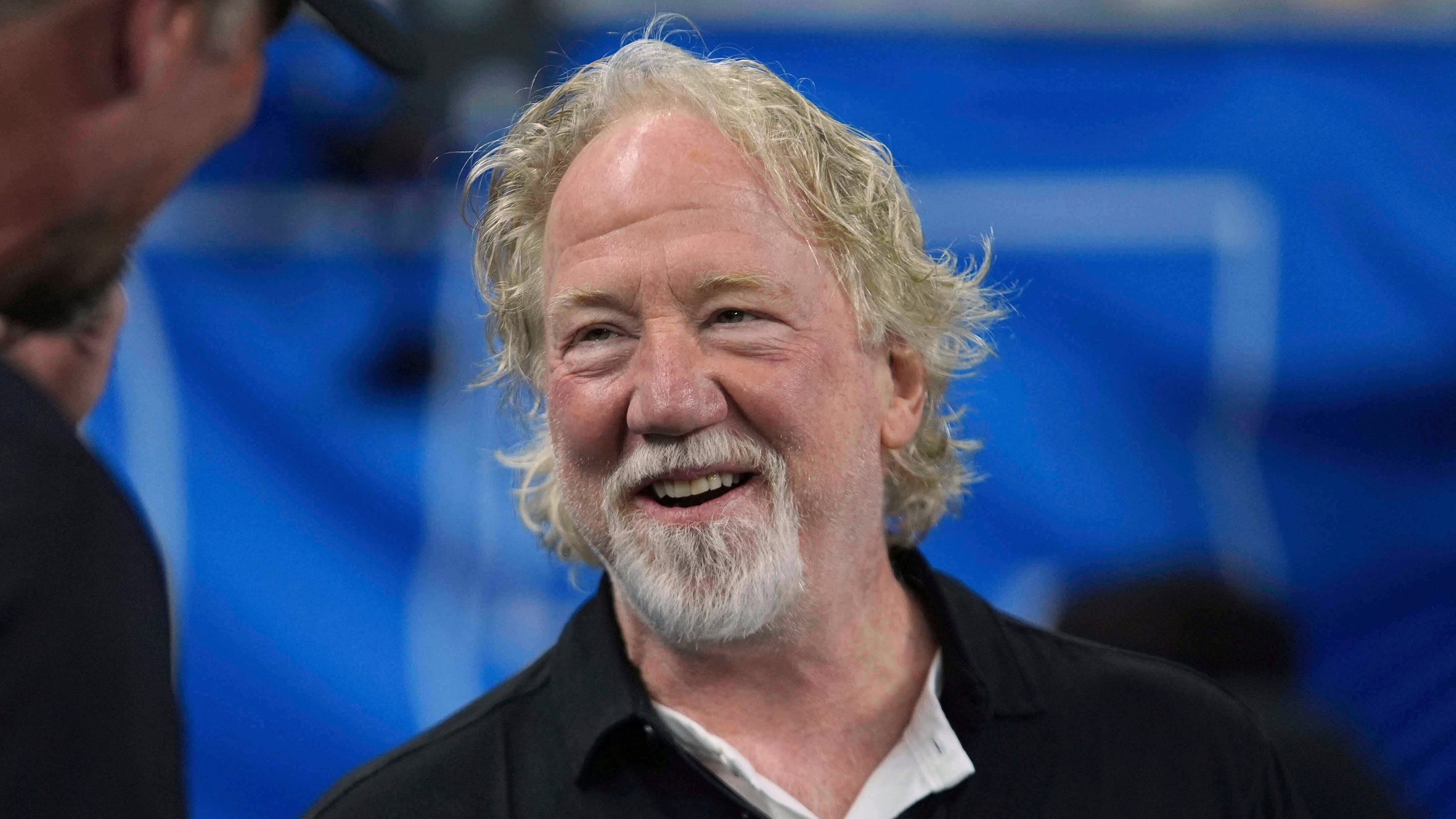 FILE - Actor Timothy Busfield smiles before an NFL football game in Detroit, Sept. 14, 2025. (AP Photo/Paul Sancya, File)
