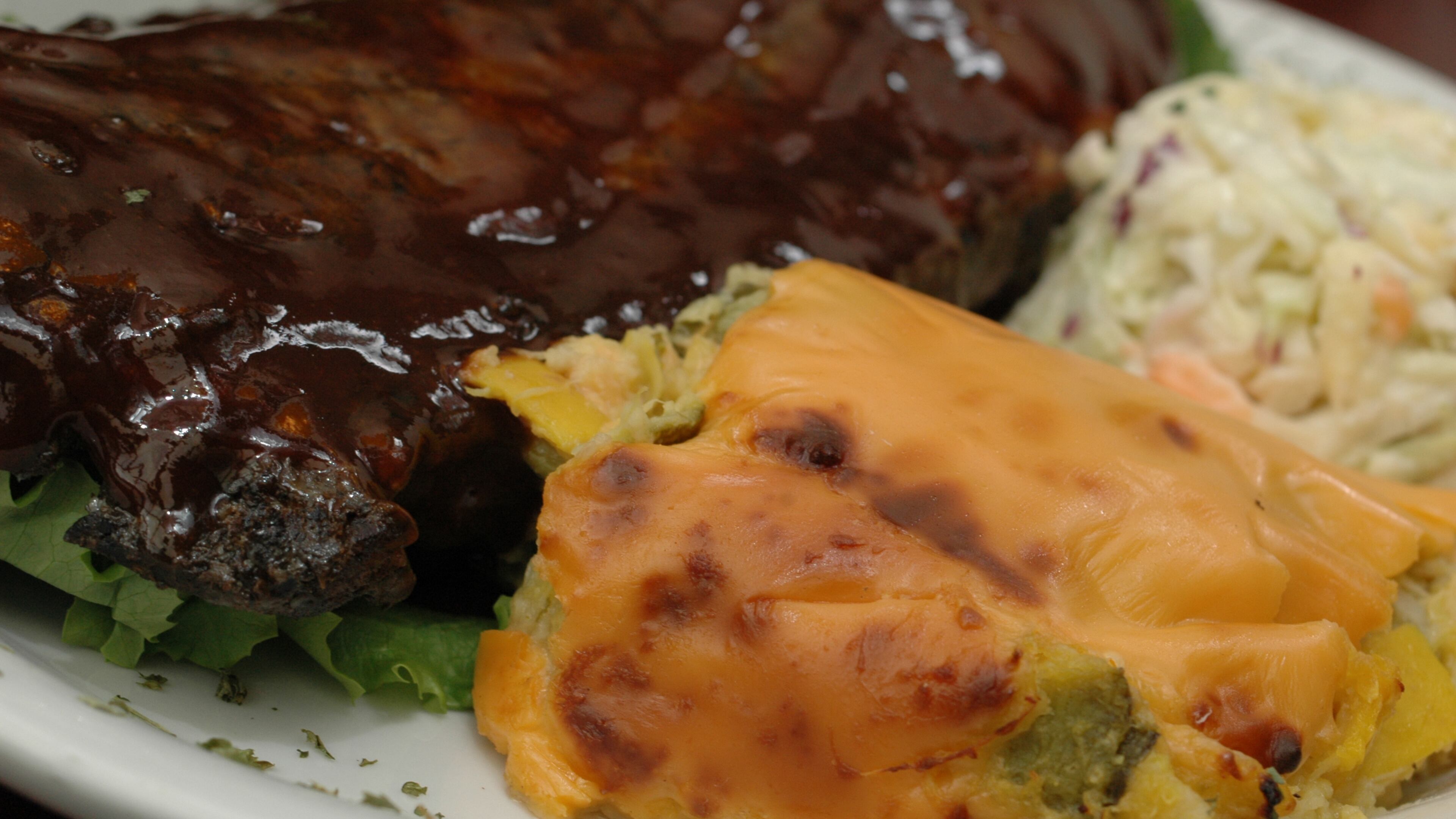 031510-ATLANTA-GA: From the Menu of: THREE DOLLAR CAFE FOOD: SQUASH CASSEROLE PICTURED WITH BBQ RIBS & COLE SLAW STYLED BY: OWNER & KITCHEN MANAGER, PETER HAM (ADRIENNE HARRIS/special)