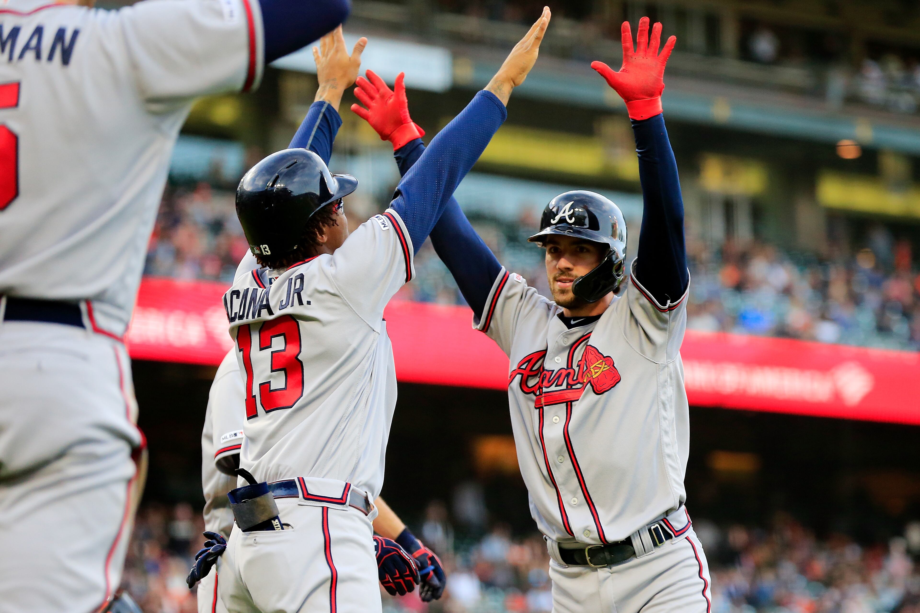 SAN FRANCISCO, CALIFORNIA - MAY 22: Dansby Swanson #7 of the Atlanta Braves celebrates hitting a three run home run with Ronald Acuna Jr. #13 during the second inning against the San Francisco Giants at Oracle Park on May 22, 2019 in San Francisco, California. (Photo by Daniel Shirey/Getty Images)