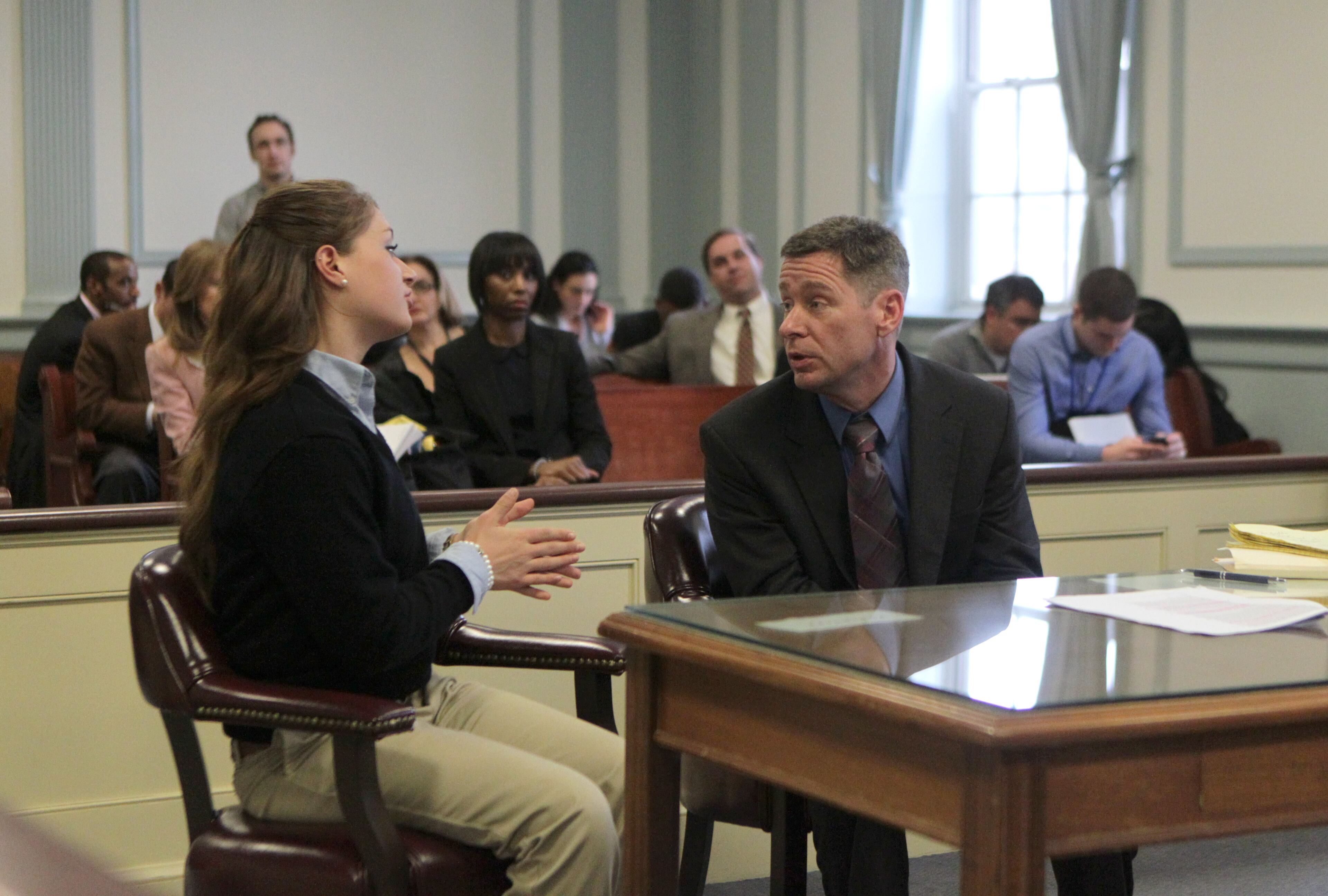Rachel Canning, left, briefly talks with her father Sean during a hearing at the Morris County Courthouse, Tuesday, March 4, 2014, in Morristown, N.J. Canning, an honor student who says her parents kicked her out of the house when she turned 18, is now suing them, asking a court to make them support her and pay for her college. (AP Photo/The Star-Ledger, John O'Boyle, Pool)