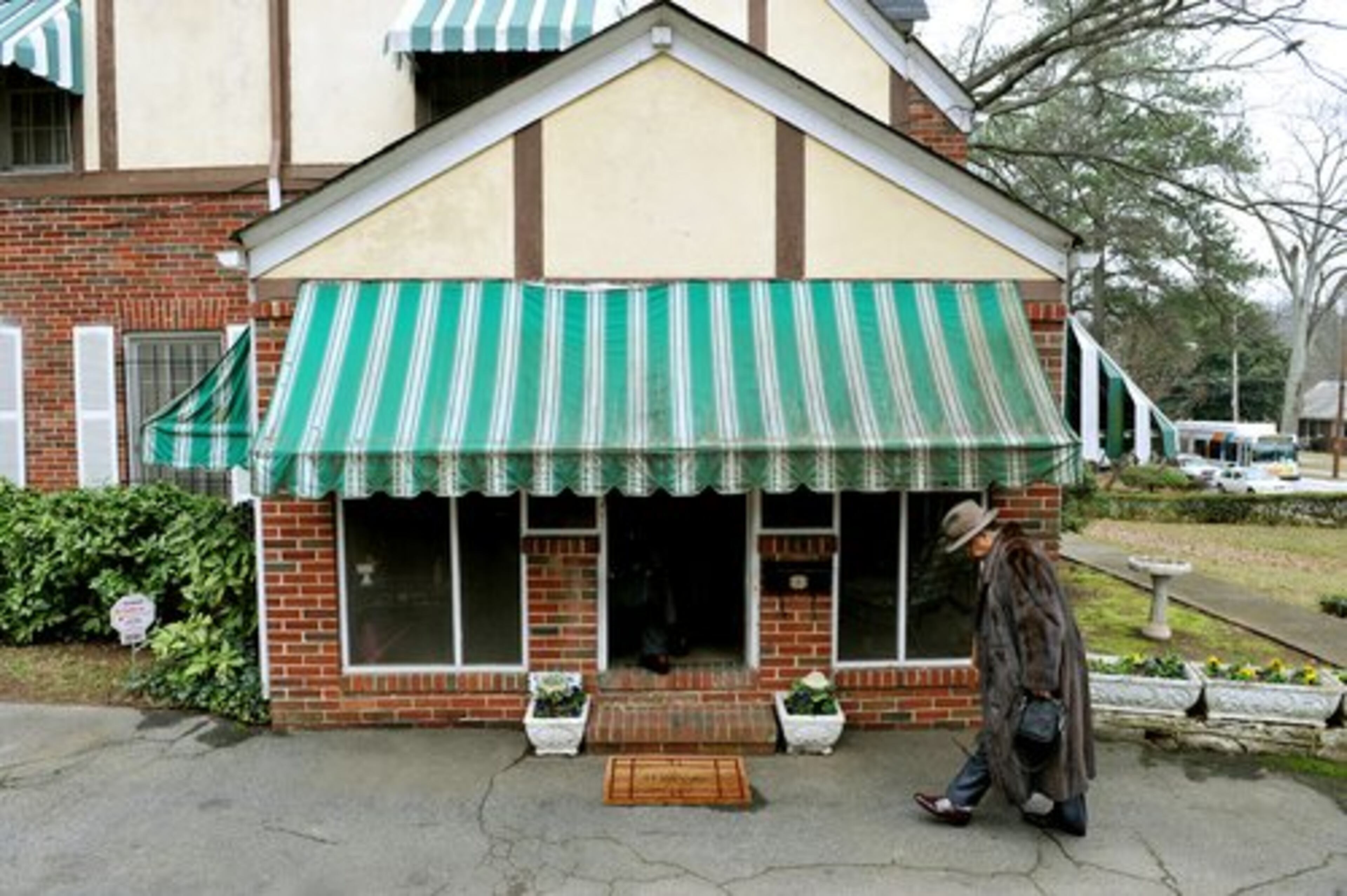 The party was at Cooper's house in Atlanta. Arriving, in foreground, is Charles Kendall.