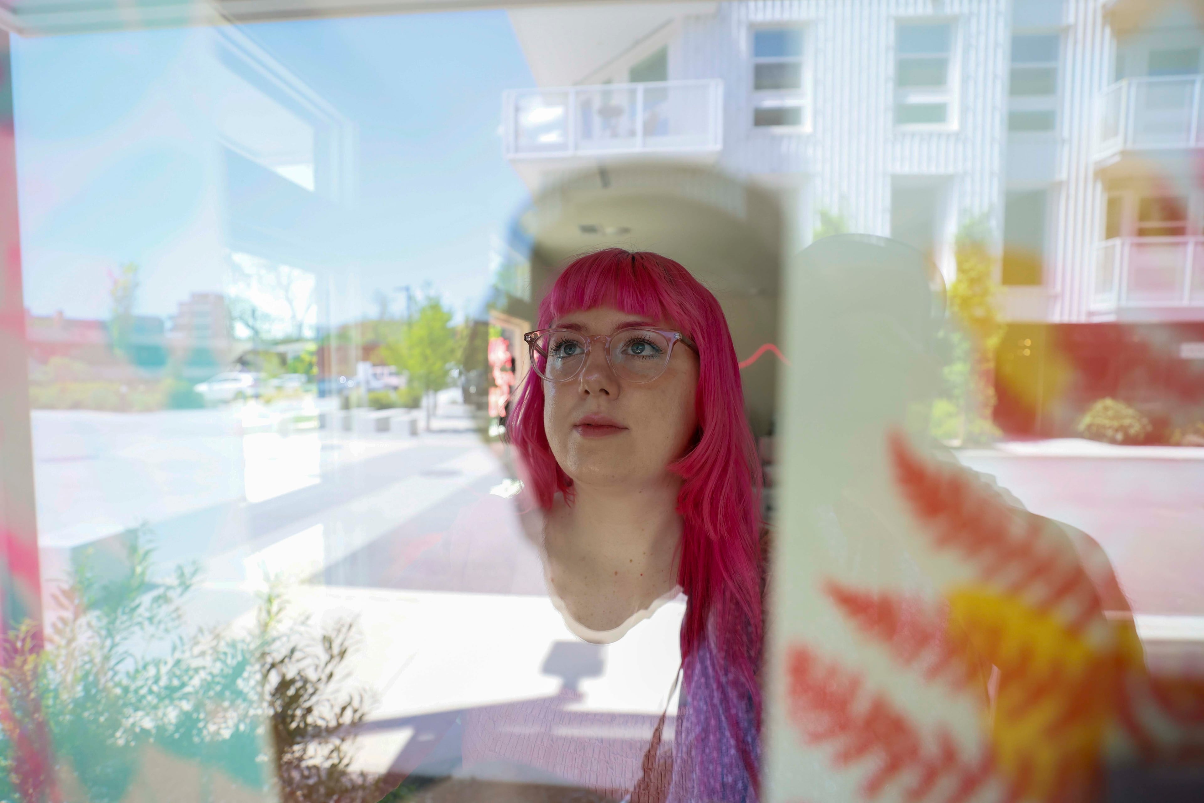 Studio owner Samantha Richardson displays prints from the last workshop at the window of her Posy Press studio on Tuesday, April 14, 2026. (Miguel Martinez/AJC)