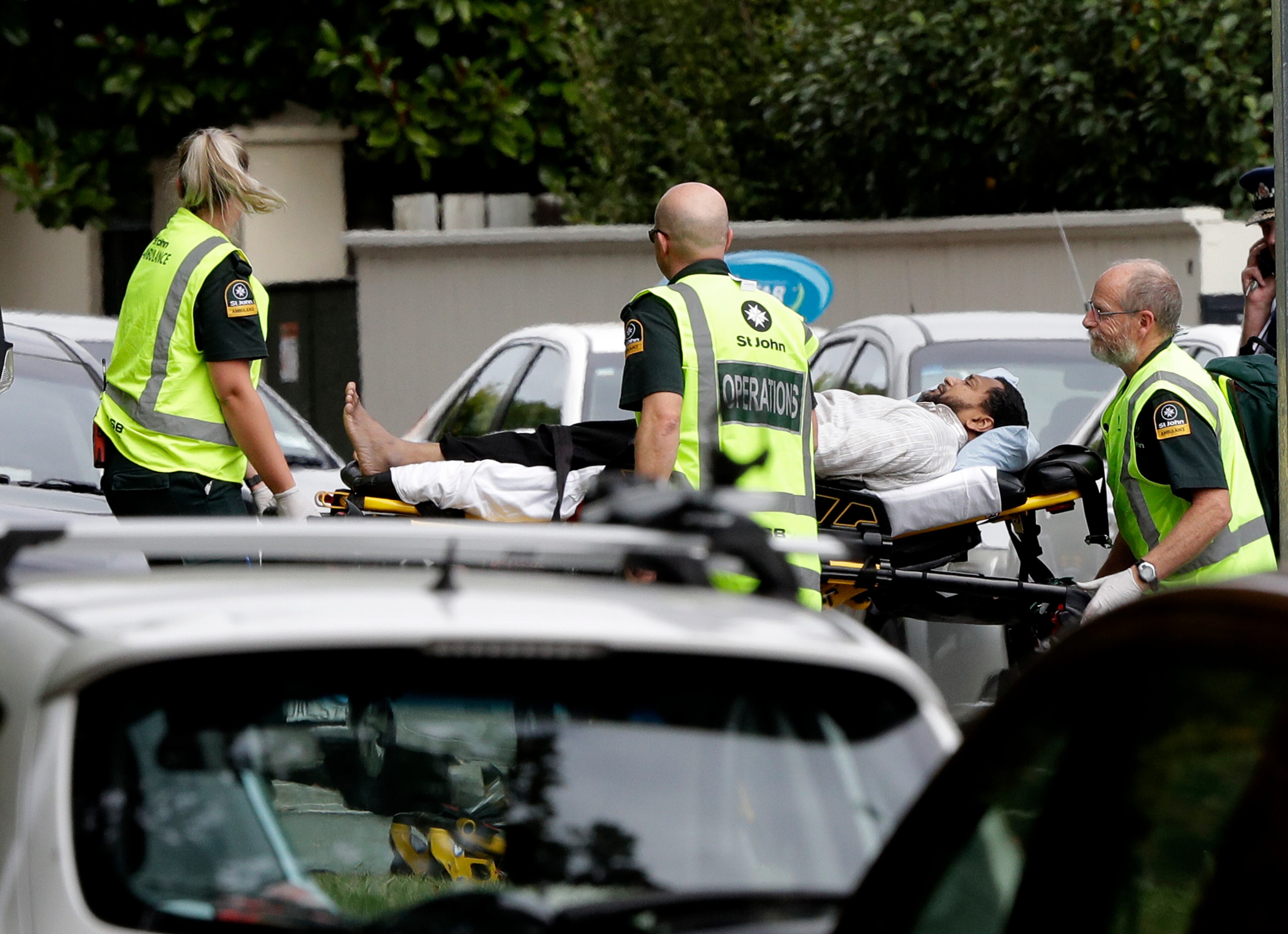 Ambulance staff take a man from outside a mosque in central Christchurch, New Zealand, Friday, March 15, 2019. A witness says many people have been killed in a mass shooting at a mosque in the New Zealand city of Christchurch.