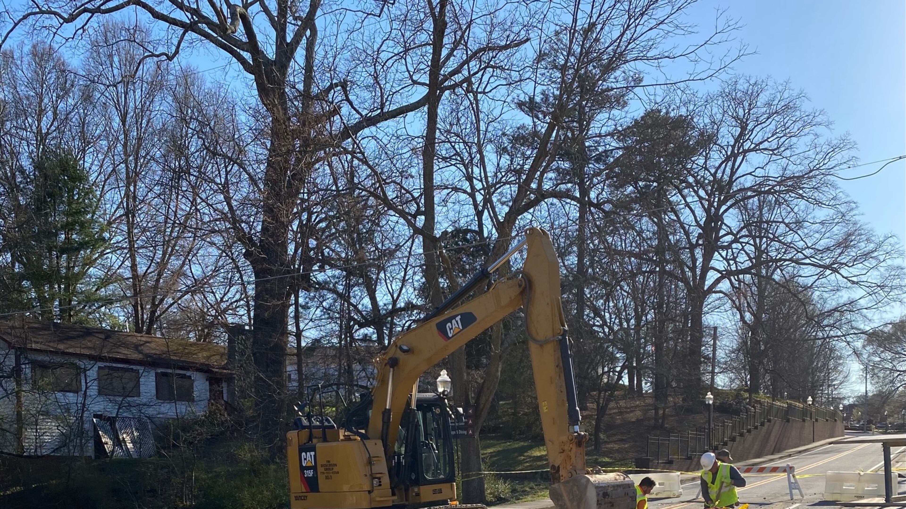 A collapsed culvert on Lawrenceville Street at Mitchell Road in Norcross has necessitated the closing of Lawrenceville Street for emergency repairs. (Photo by Karen Huppertz for the AJC)