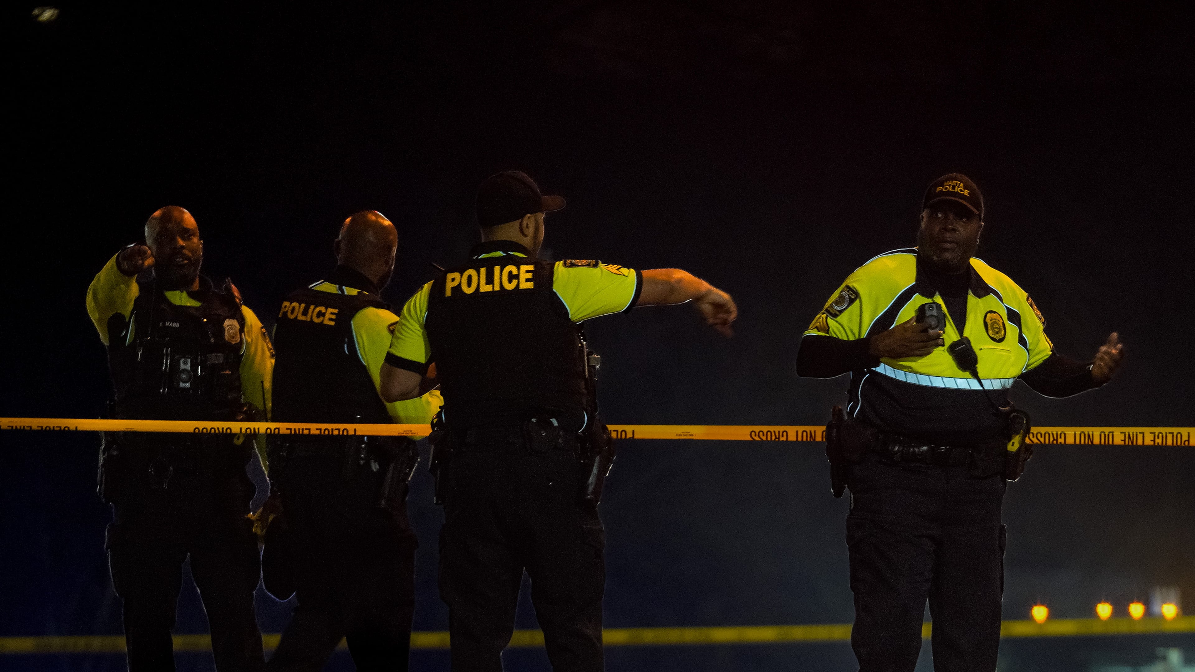 MARTA police cordon off the scene of a shooting involving one of their sergeants Monday night. The GBI will take over the investigation.