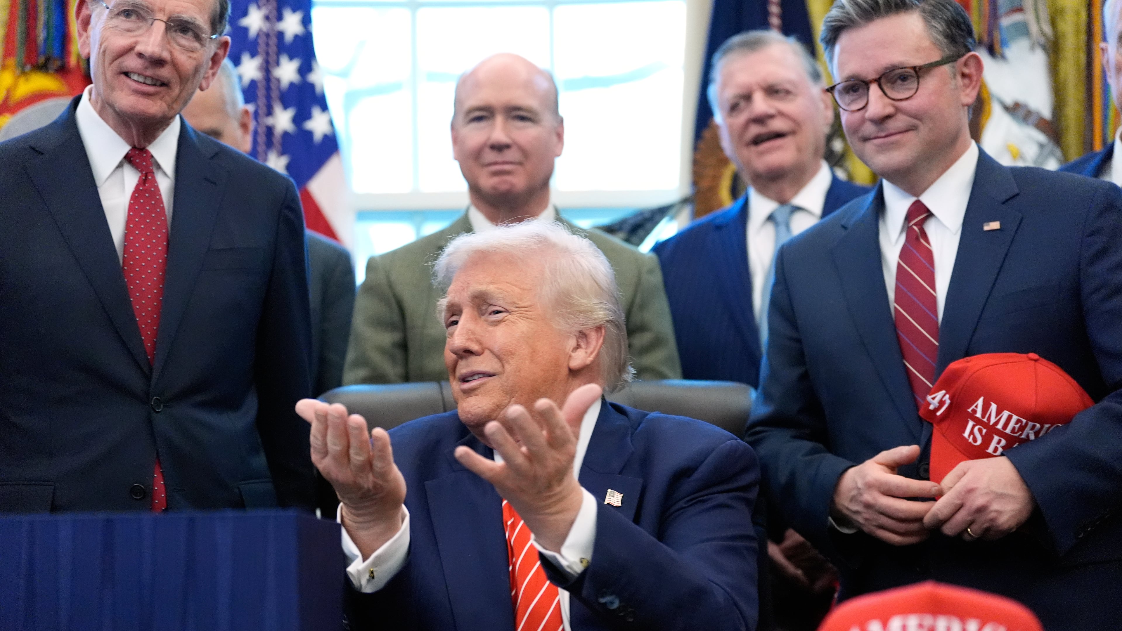 President Donald Trump speaks to reporters after signing a spending bill that ends a partial shutdown of the federal government in the Oval Office of the White House, Tuesday, Feb. 3, 2026, in Washington. (AP Photo/Alex Brandon)