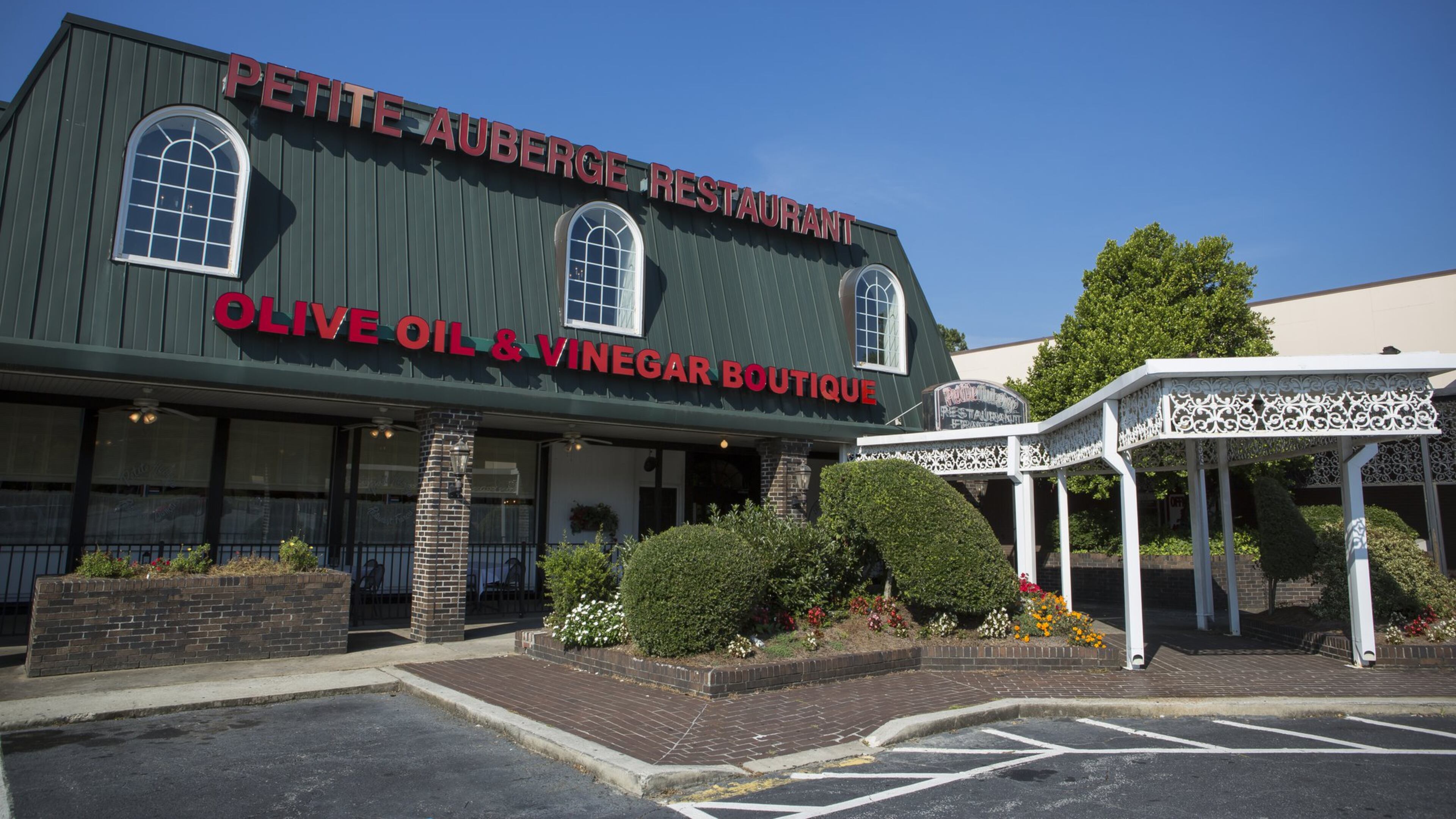 Petite Auberge, a French restaurant, is one of the longtime tenants no longer in the Toco Hill Shopping Center. CONTRIBUTED BY MICHIE TURPIN PHOTOGRAPHY