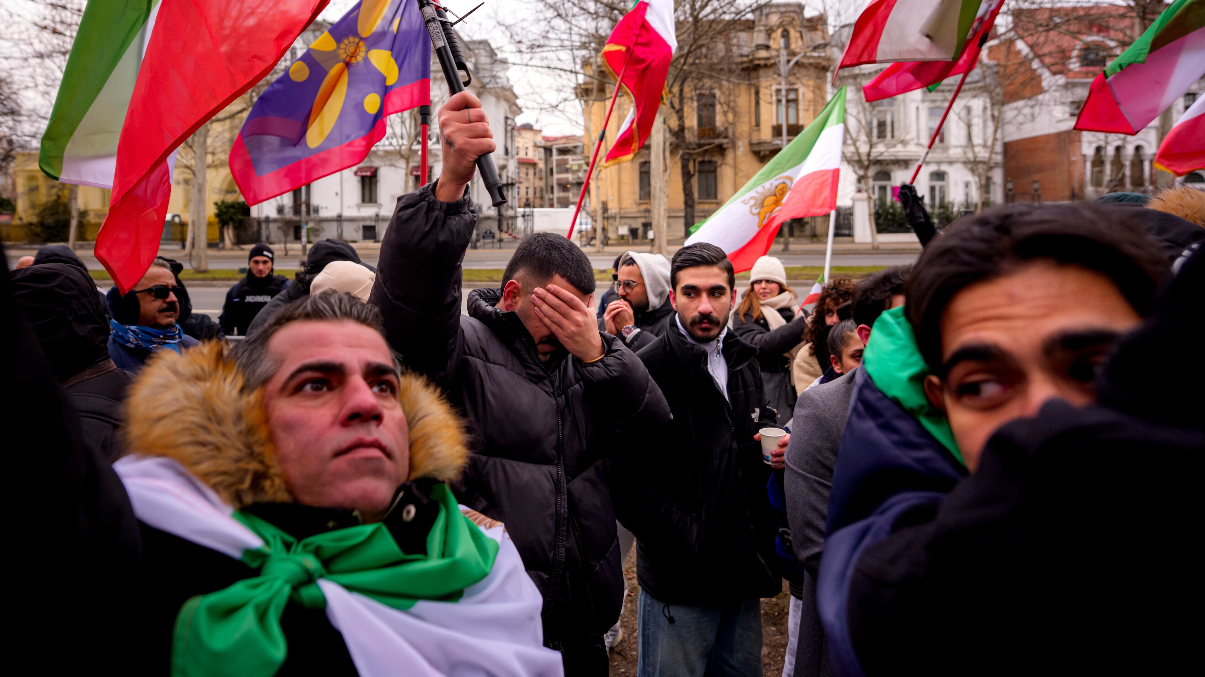 Members of the Iranian community wave flags during a rally in support of anti-government protests in Iran, in front of the Iranian embassy in Bucharest, Romania, Sunday, Feb. 1, 2026. (Andreea Alexandru/AP)