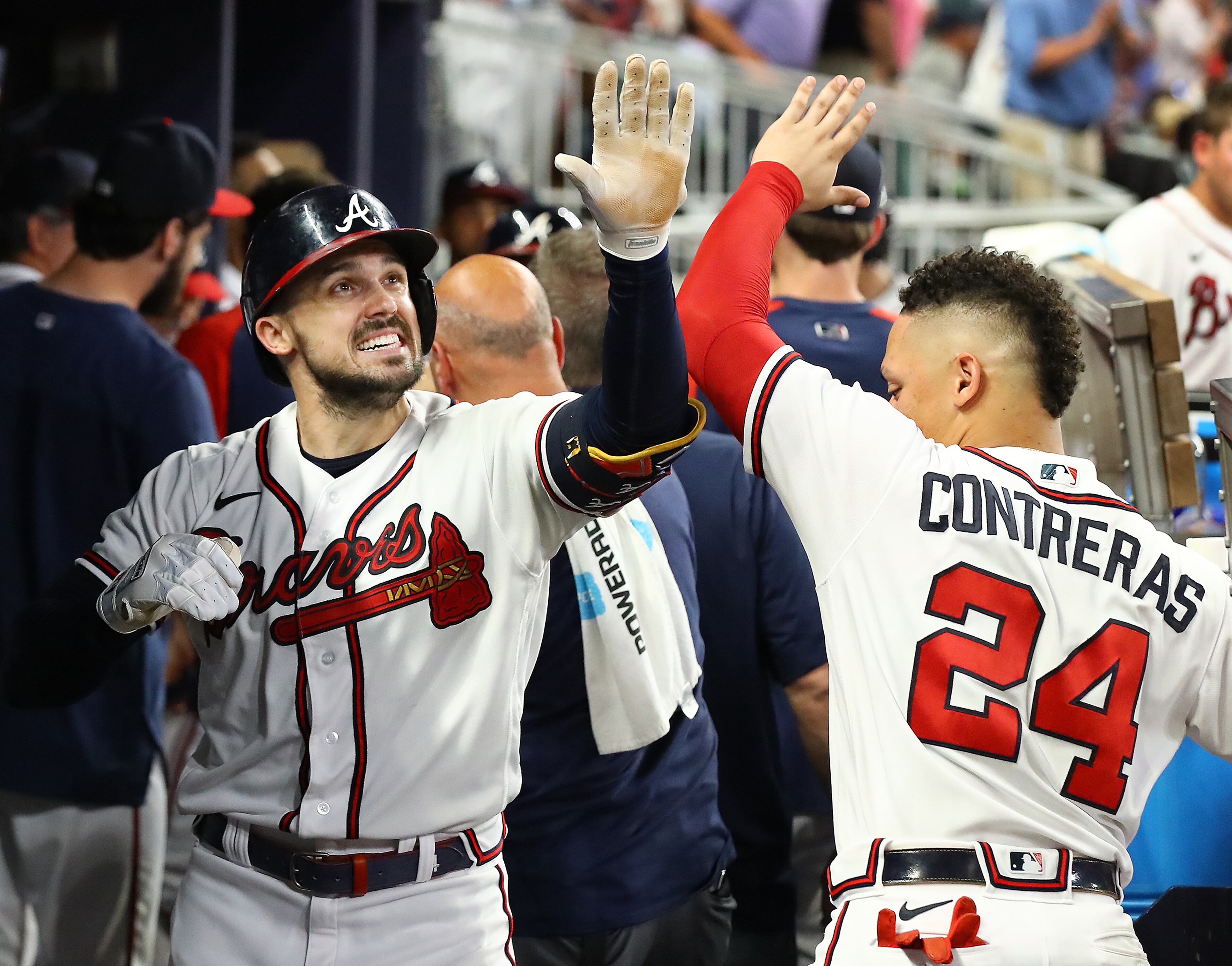 071222 Atlanta: Atlanta Braves outfielder Adam Duvall celebrates his 2-RBI home run with William Contreras in the dugout taking a 4-1 lead over the New York Mets during the seventh inning in a MLB baseball game on Tuesday, July 12, 2022, in Atlanta. “Curtis Compton / Curtis Compton@ajc.com”