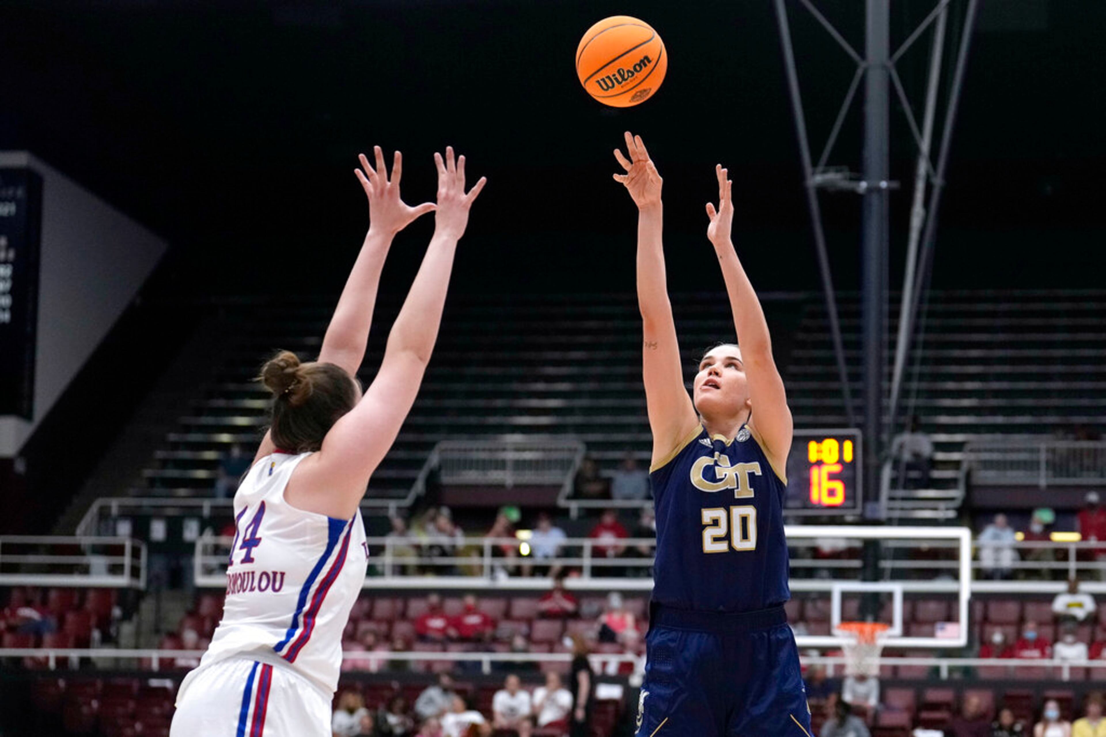 Georgia Tech center Nerea Hermosa (20) shoots over Kansas center Danai Papadopoulou (14) during the first half of a first-round game in the NCAA women's college basketball tournament Friday, March 18, 2022, in Stanford, Calif. (AP Photo/Tony Avelar)