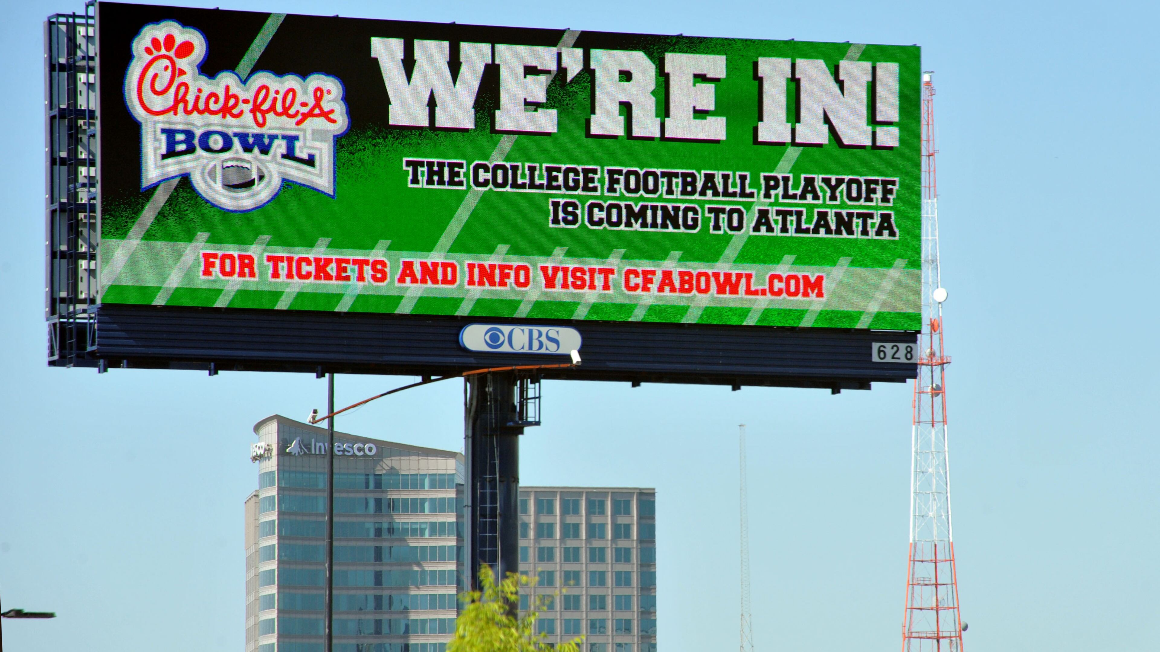 A revolving billboard advertising the Chick-Fil-A Peach Bowl is shown Thursday, April 25, 2013.