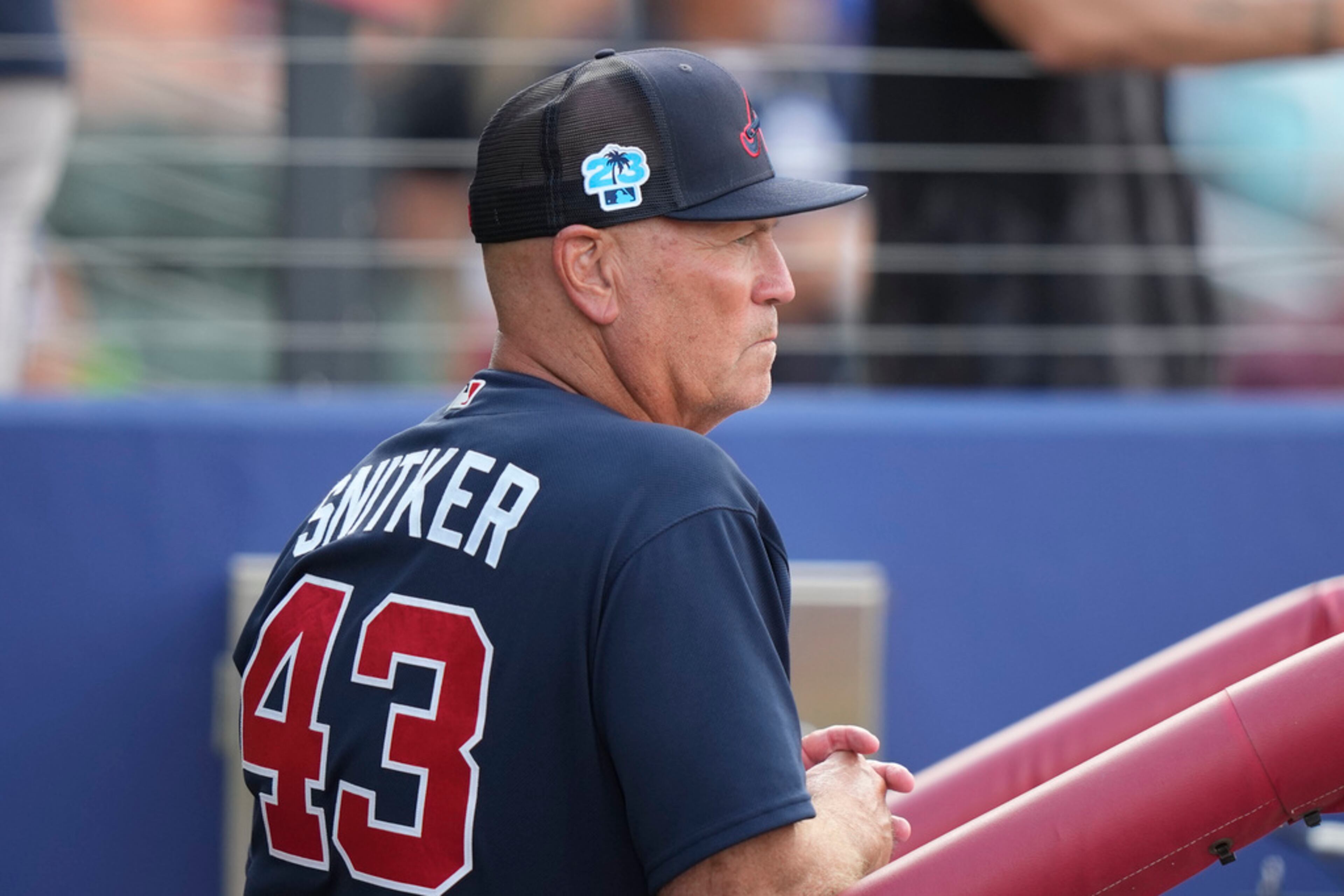 Atlanta Braves manager Brian Snitker watches from the dugout in the second inning of a spring training baseball game against the Philadelphia Phillies in North Port, Fla., Saturday, March 18, 2023. (AP Photo/Gerald Herbert)