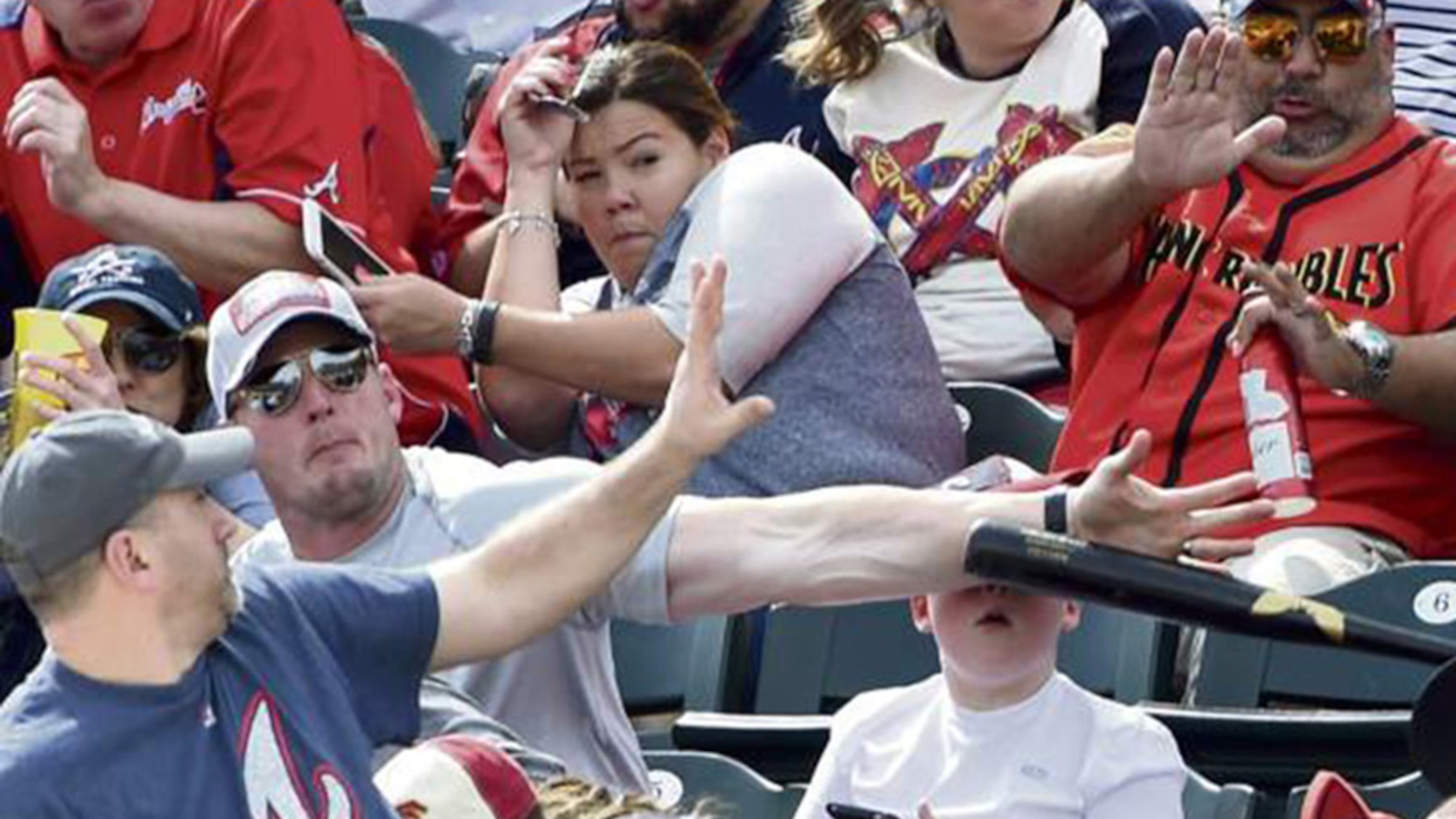 Pittsburgh photographer Chris Horner captured this image of bat flying toward young Braves fan during Saturday's game in Lake Buena Vista, Fla.