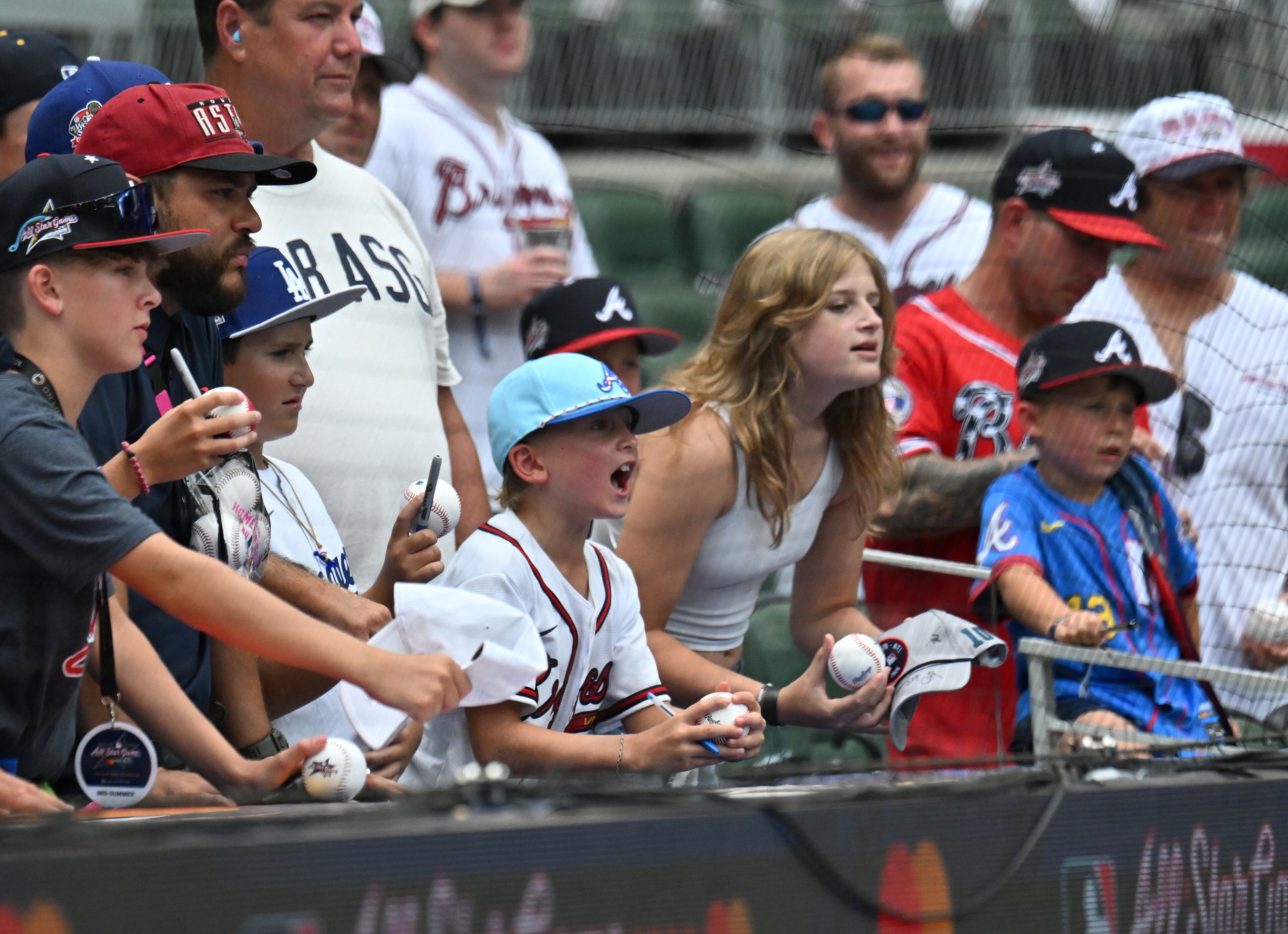 Baseball fans ask for autographs before the 2025 MLB All-Star Game at Truist Park, Tuesday, July 15, 2025, in Atlanta. (Hyosub Shin/AJC)