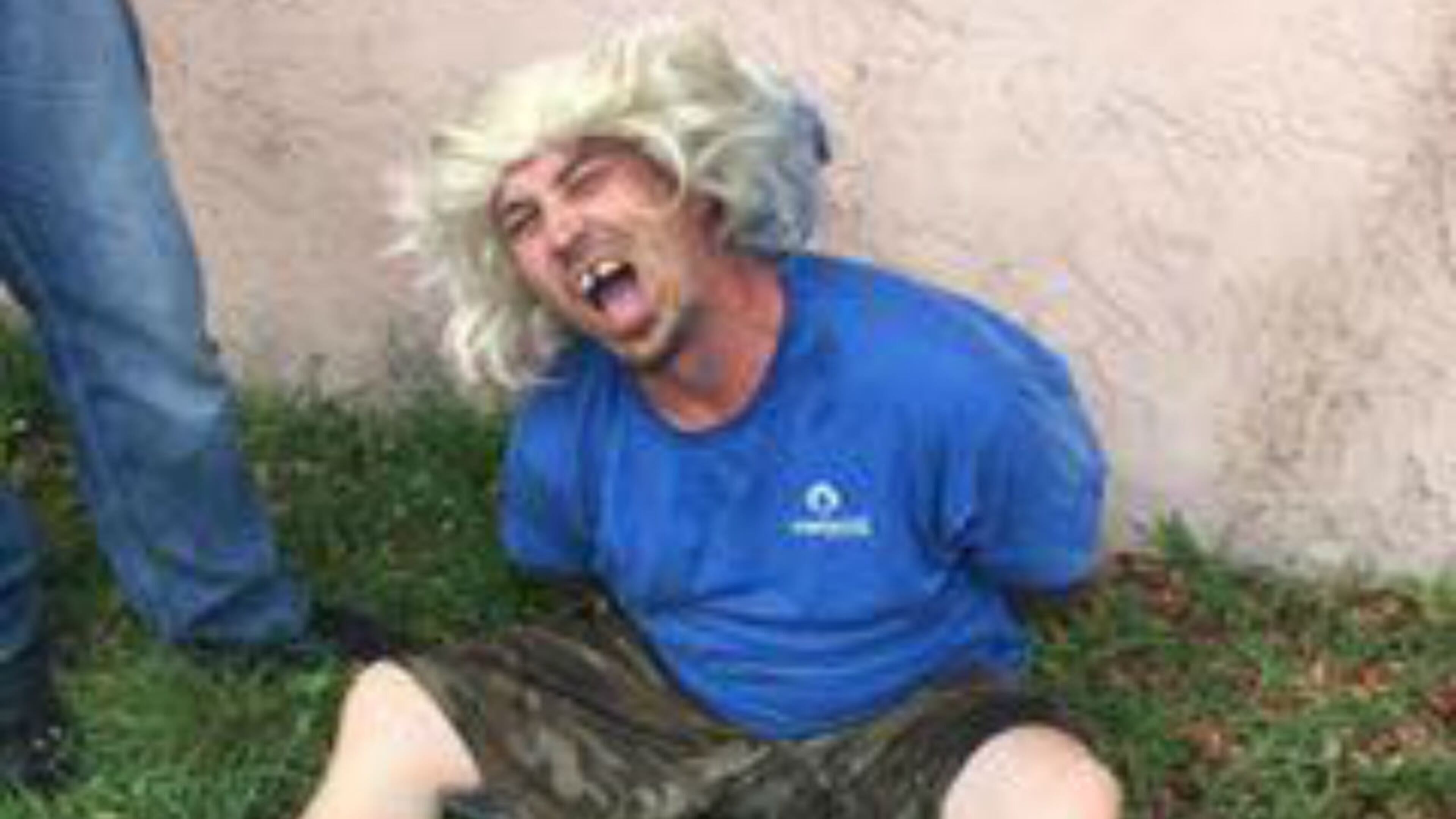 A Florida man tried to elude deputies by donning a long-haired blonde wig while riding a bicycle away, investigators said. (Photo: Brevard County Sheriff's Office)