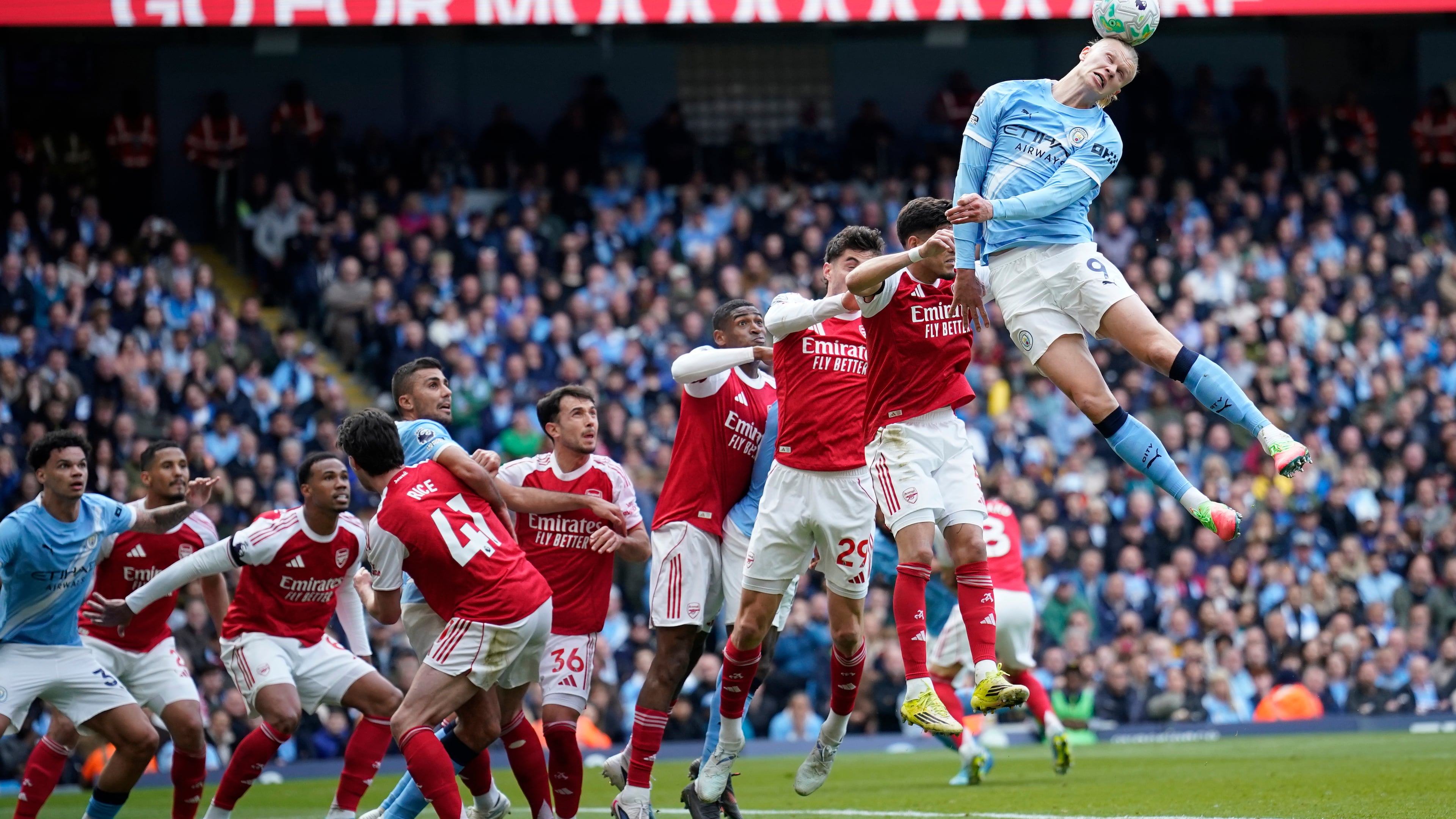 Manchester City's Erling Haaland heads the ball during the English Premier League soccer match between Manchester City and and Arsenal, in Manchester, England, Sunday, April 19, 2026. (AP Photo/Dave Thompson)