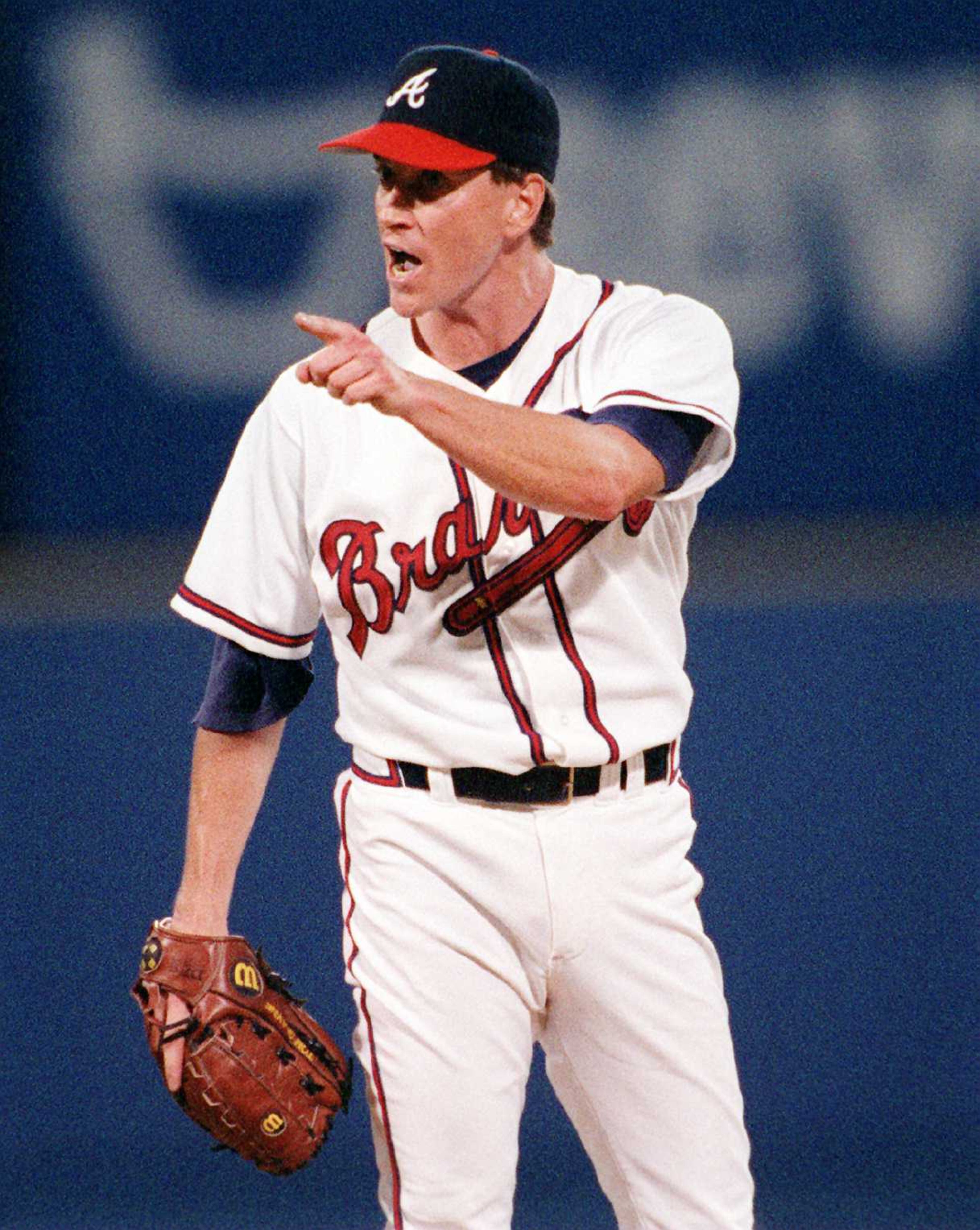 Braves pitcher Tom Glavine points his finger at home plate umpire Gary Darling in the sixth inning after Darling took off his mask to have words with the pitcher in 1996.