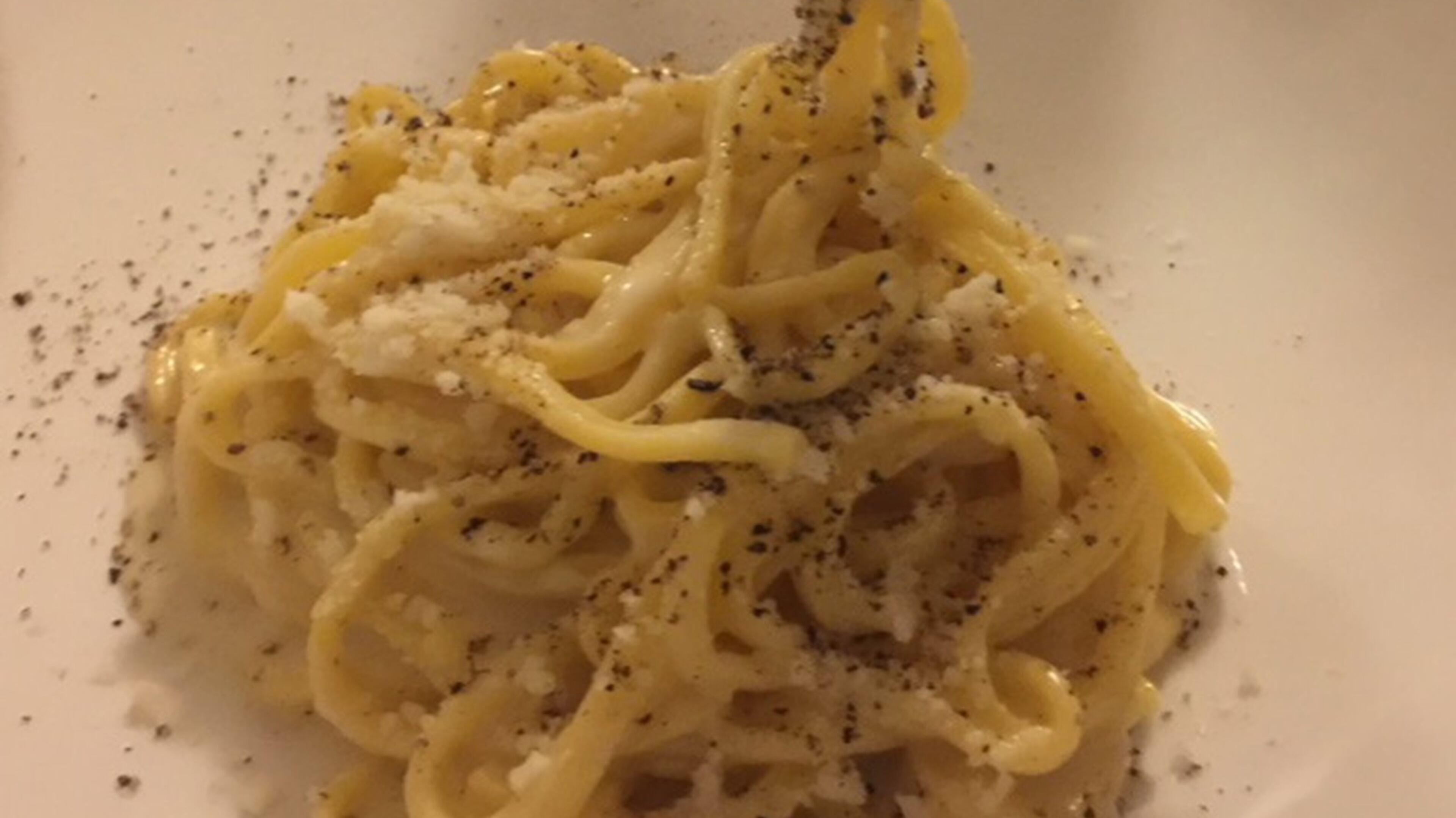 Cacio de pepe, Rome’s beloved dish, is simply parmesan and usually a little pecorino and lots of black pepper tossed with hot pasta and sometimes a little starchy pasta water. (Kathleen Purvis/Charlotte Observer/TNS)