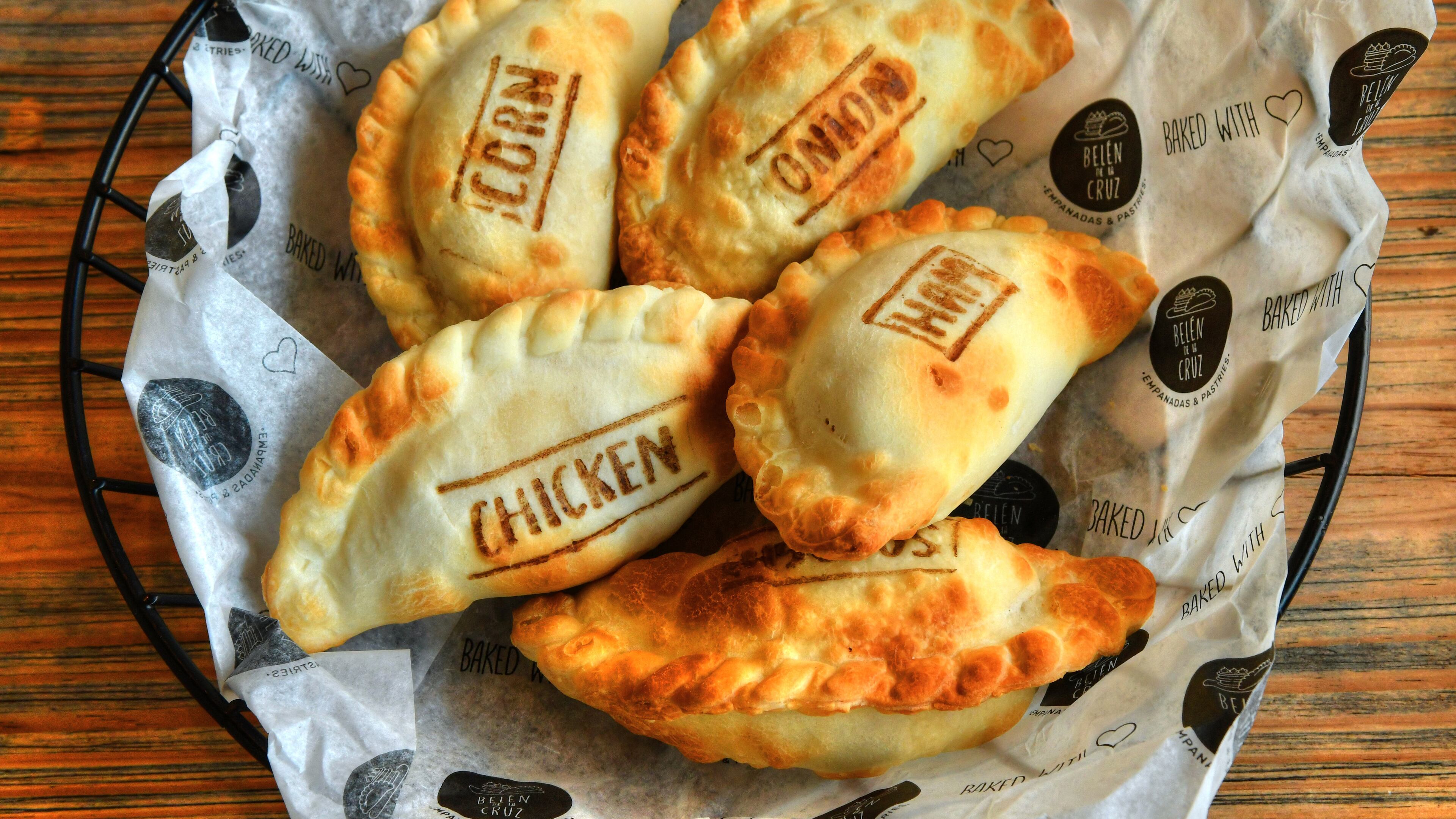An assortment of empanadas from Belen de la Cruz. Photo taken Thursday, April 28, 2022. (CHRIS HUNT FOR THE ATLANTA JOURNAL-CONSTITUTION)