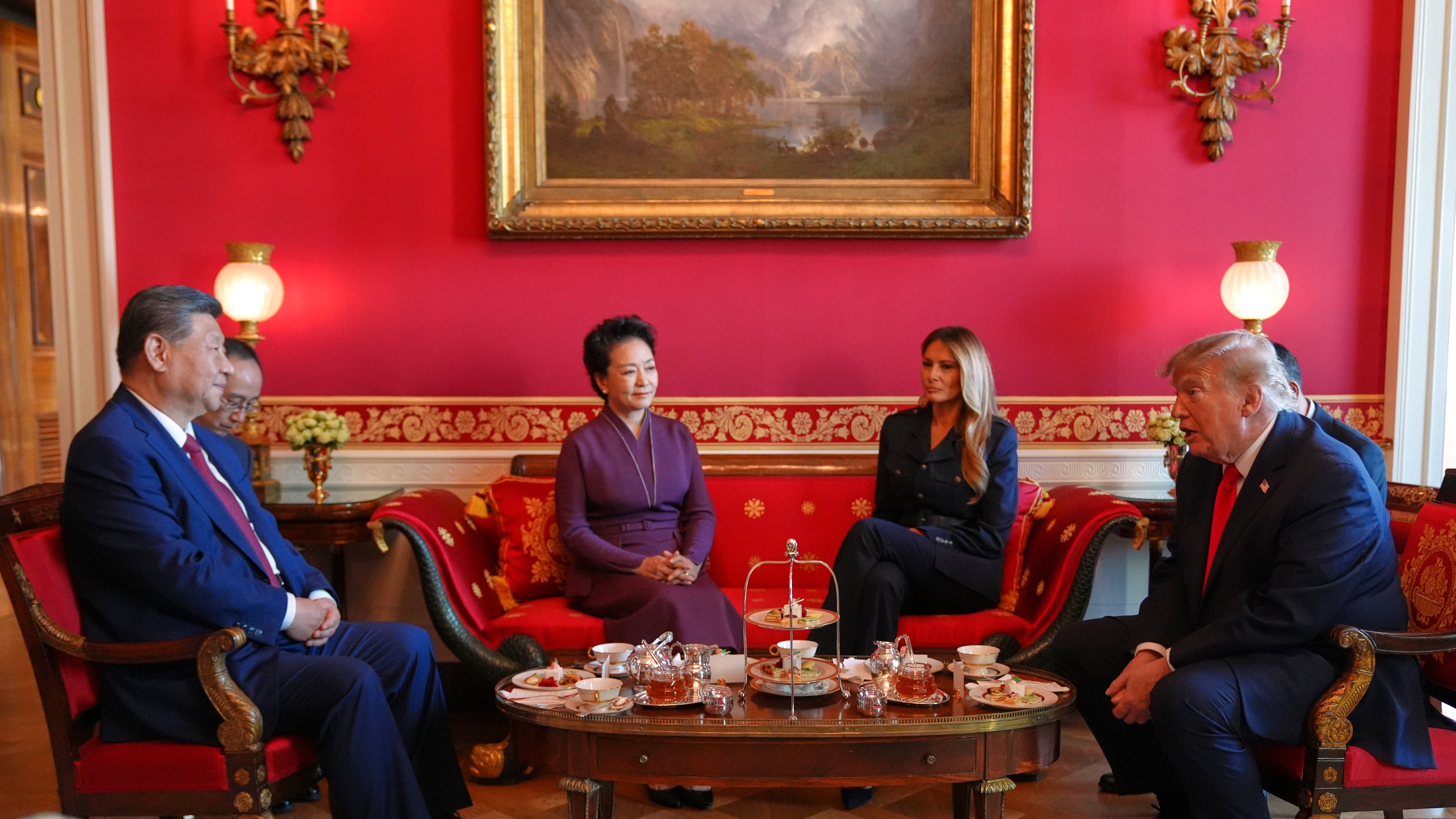 President Donald Trump, from right, and first lady Melania Trump attend a tea with China's President Xi Jinping, from left, and his wife Peng Liyuan in the Red Room of the White House, Friday, Sept. 25, 2026, in Washington. (AP Photo/Jacquelyn Martin)