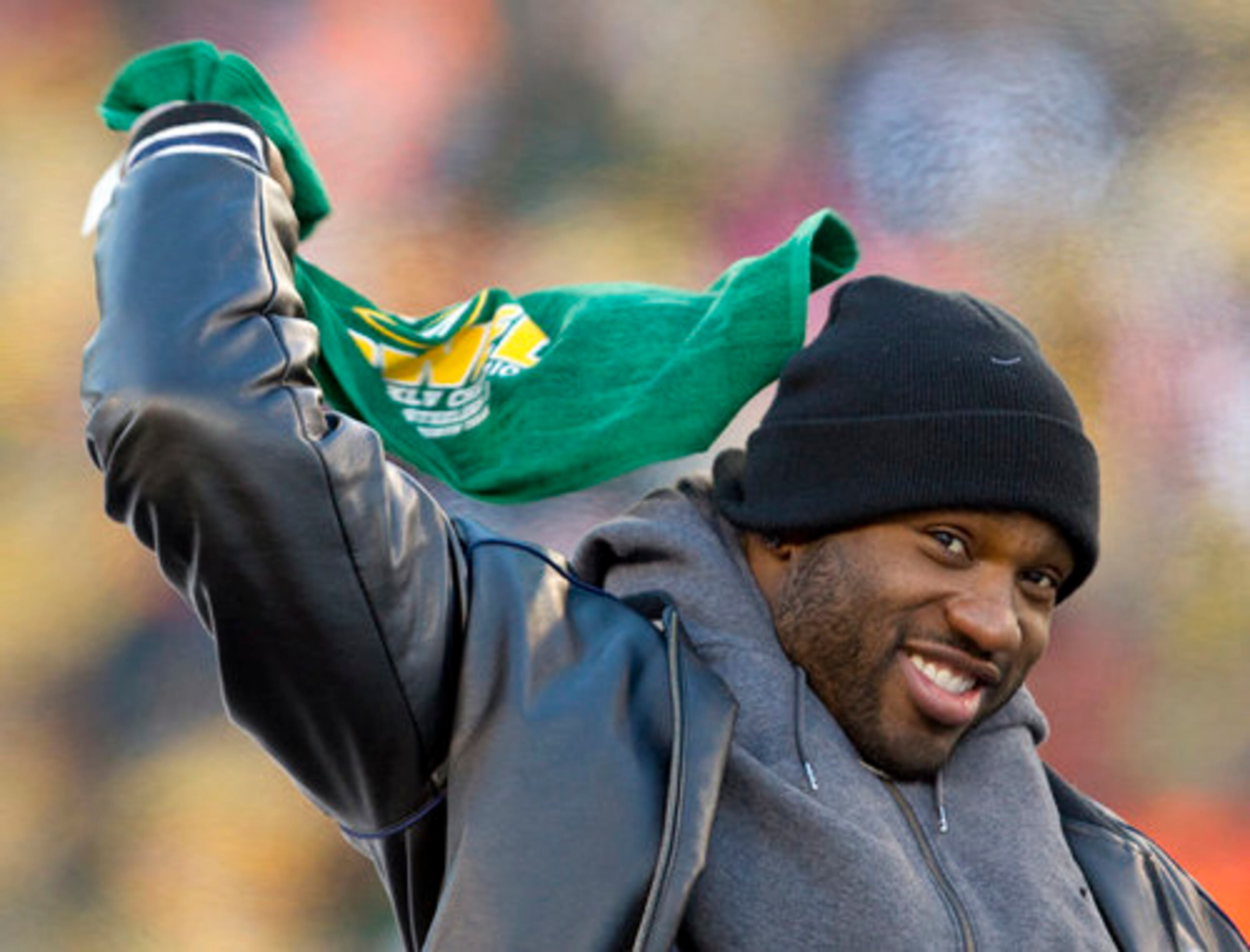 Green Bay Packers safety Nick Collins waves what is dubbed the "Titletown Towel." Fans of the Pittsburgh Steelers, whom the Packers defeated 31-25 in the Super Bowl, often wave the "Terrible Towel."
