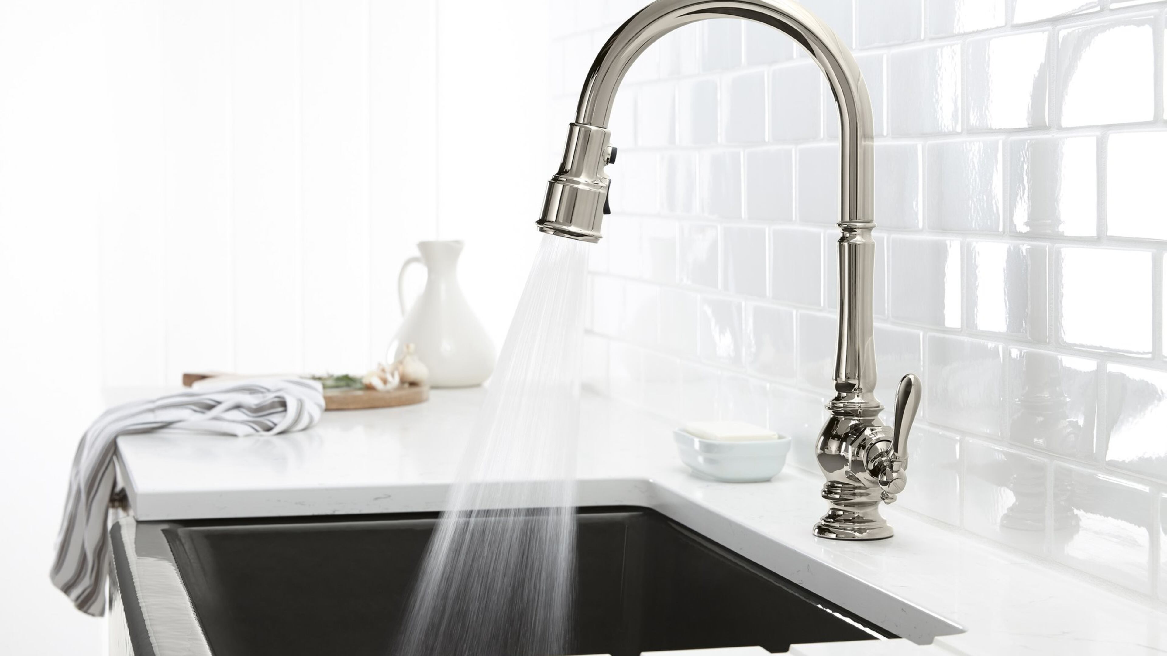 A pull-out faucet has the edge when filling things like dog dishes and coffee makers outside of the sink bowl. (Kohler)