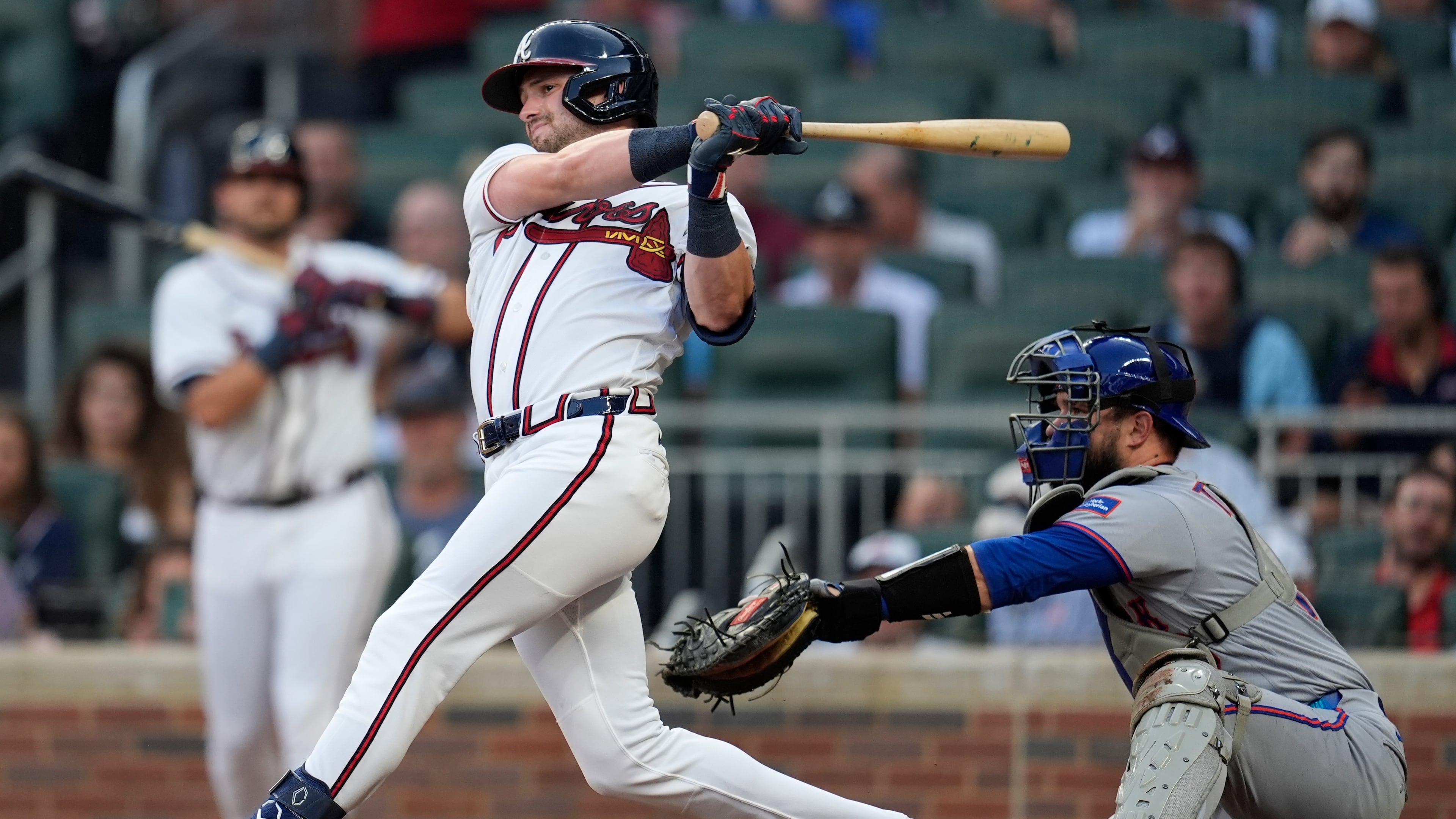 Atlanta Braves' Lane Thomas (20) hits a solo homerun against the New York Mets in the second inning of a baseball game, Wednesday, Aug. 12, 2026, in Atlanta. (AP Photo/Mike Stewart)