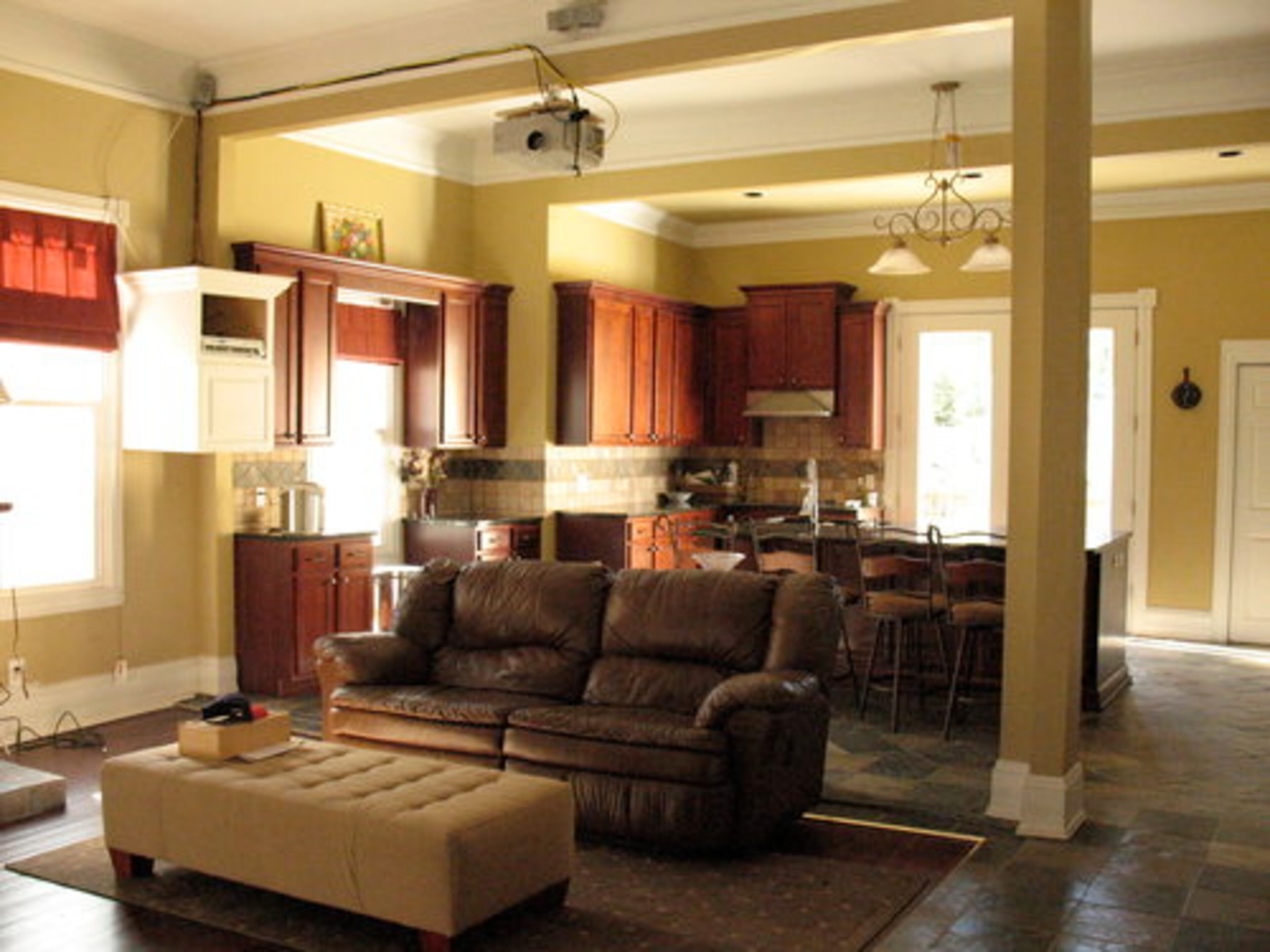 The open kitchen and sitting area feature a new slate floor. There was no floor in this area when the couple bought the house.