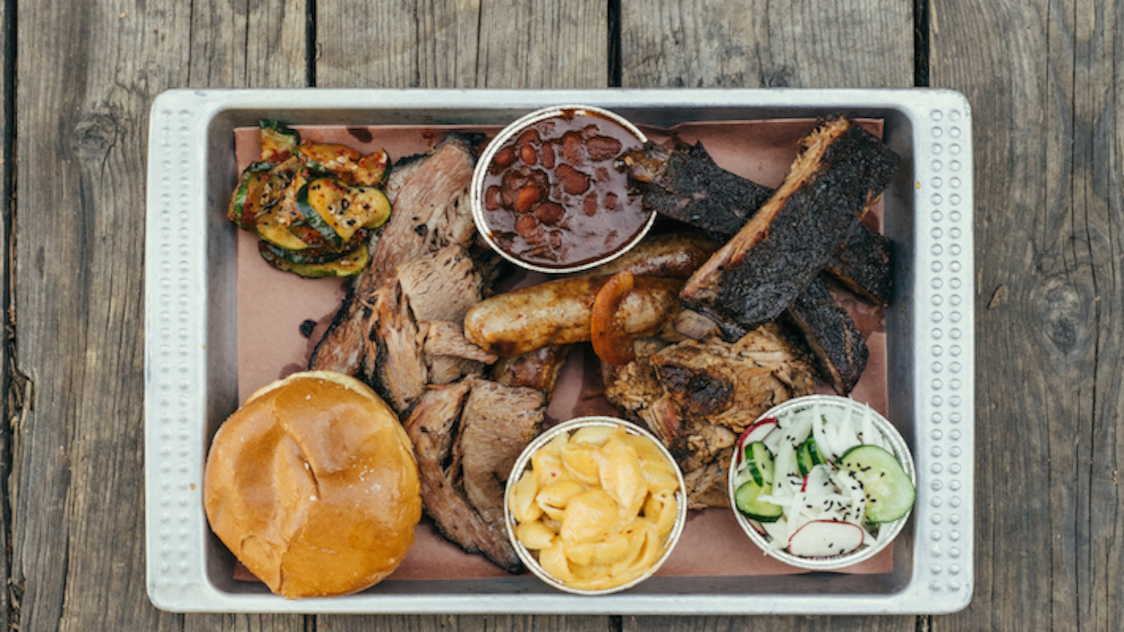 Korean influences go into what otherwise looks like a traditional tray of barbecue at Heirloom Market BBQ in Atlanta. CREDIT: Jang Choe, Heirloom Market BBQ.