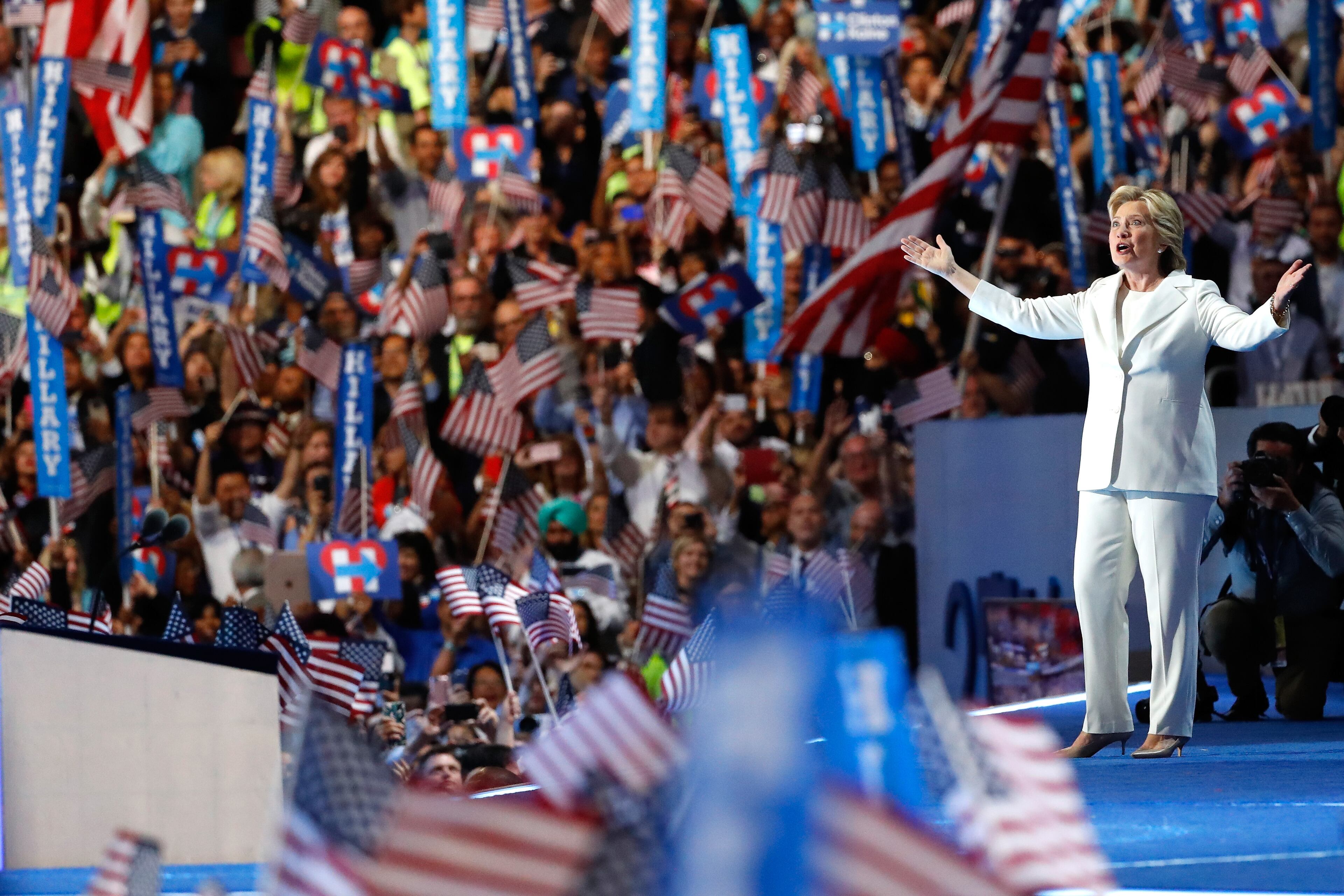 Democratic presidential nominee Hillary Clinton acknowledges the crowd as she arrives on stage during the fourth day of the Democratic National Convention at the Wells Fargo Center, July 28, 2016 in Philadelphia. (Photo by Aaron P. Bernstein/Getty Images)