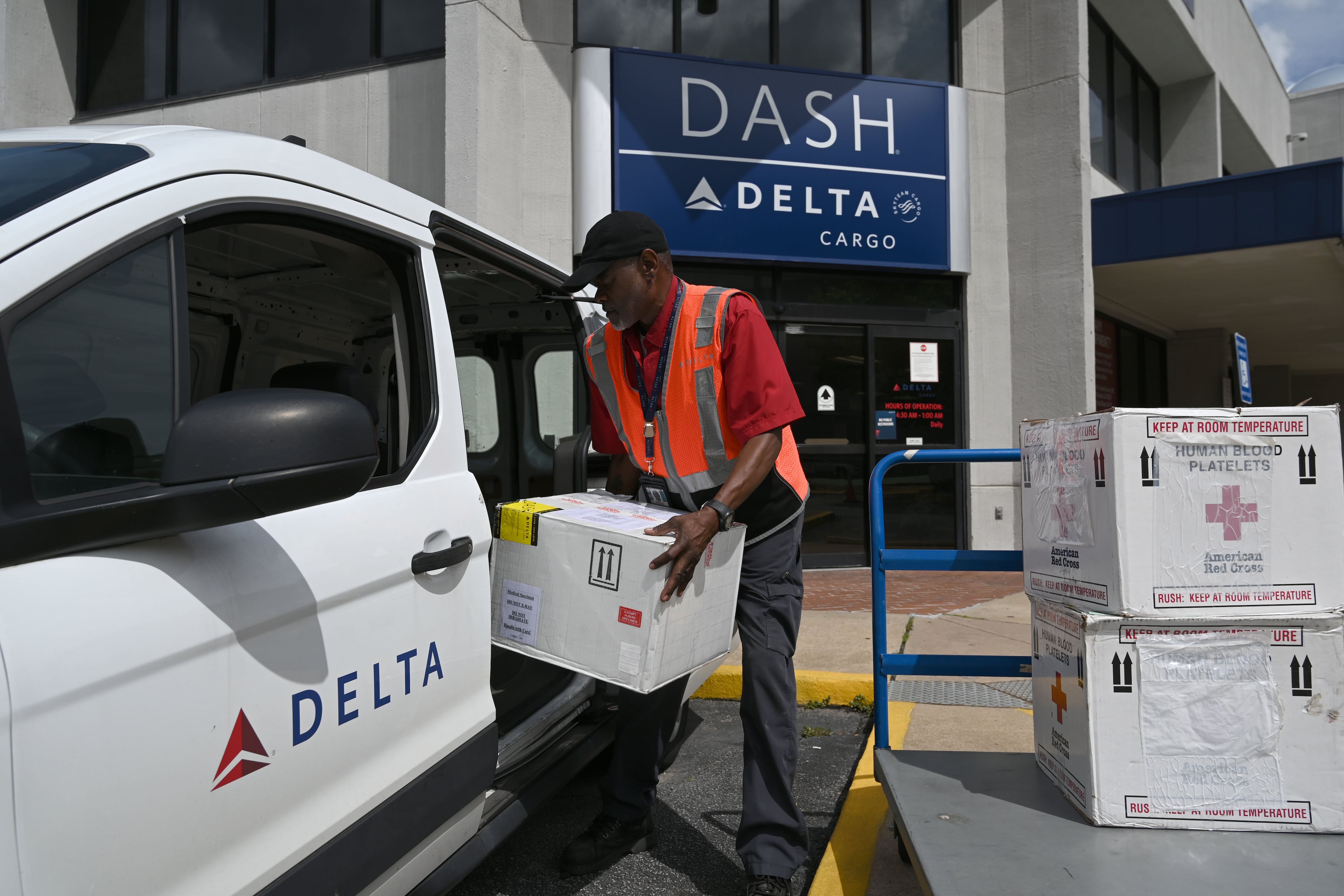 Kirkland Gibbs handles package drop-off at the Delta DASH office at Hartsfield-Jackson Atlanta International Airport on Thursday, May 28, 2026, in Atlanta. Delta DASH is Delta Air Lines’ same‑day express shipping service, providing fast air transport for time‑sensitive packages with priority handling across the airline’s domestic network. (Hyosub Shin/AJC)