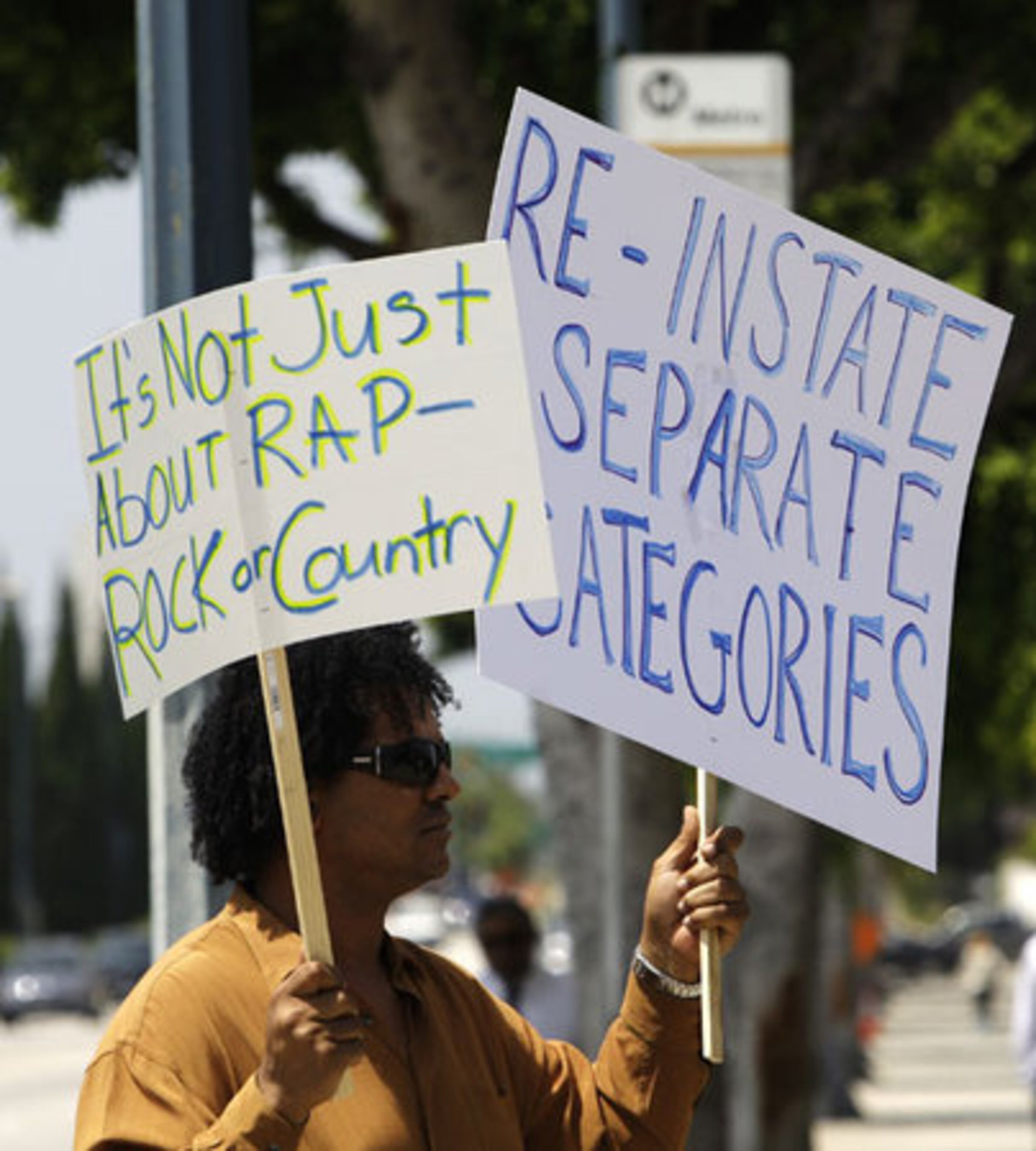Musician and producer Gaston Rene joins musicians and others demonstrators to demand the cut Grammy categories be re-instated.