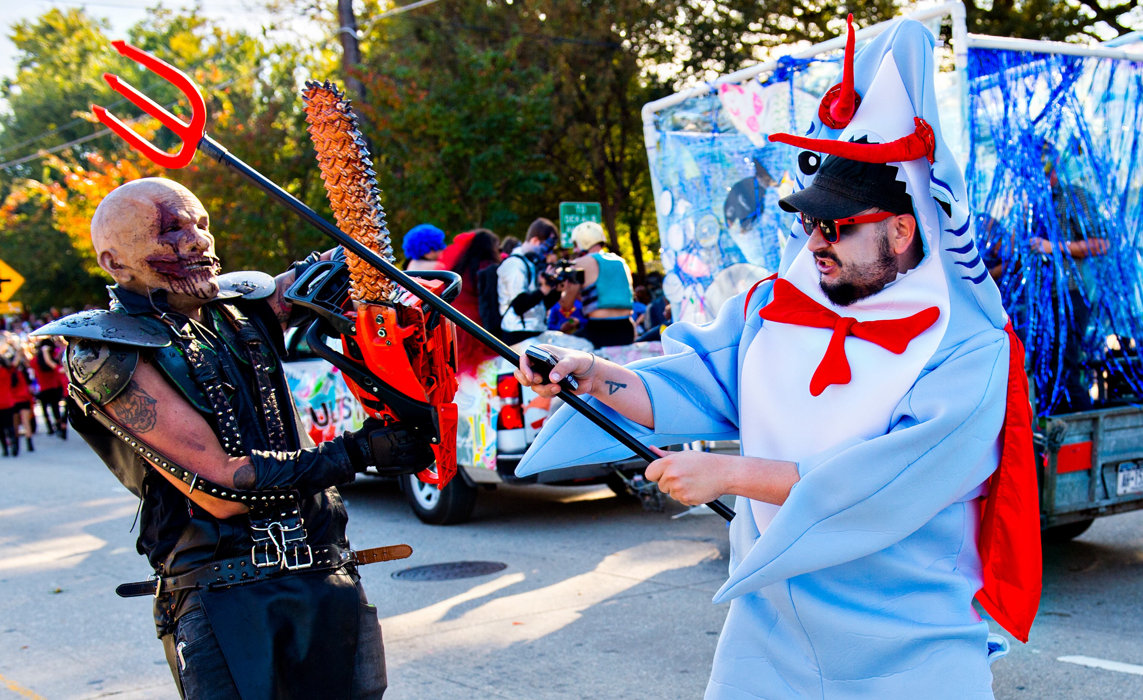 October 17, 2015 Atlanta - Lucas Godfrey (left) battles Eddie Ray in the street during the Little Five Points Halloween Parade in Atlanta on Saturday, October 17, 2015. The annual parade brought out tens of thousands of people to watch the antics. JONATHAN PHILLIPS / SPECIAL