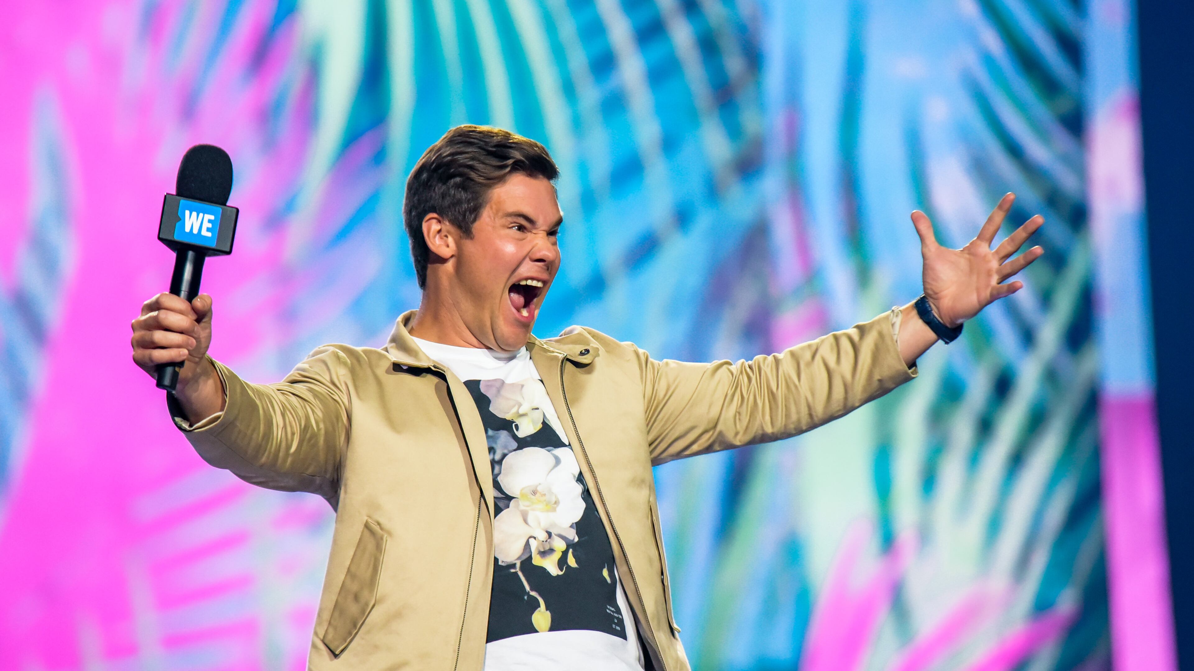 TORONTO, ON - SEPTEMBER 20: Adam Devine speaks on stage during the 2018 WE Day Toronto Show at Scotiabank Arena on September 20, 2018 in Toronto, Canada. (Photo by Dominik Magdziak/Getty Images)