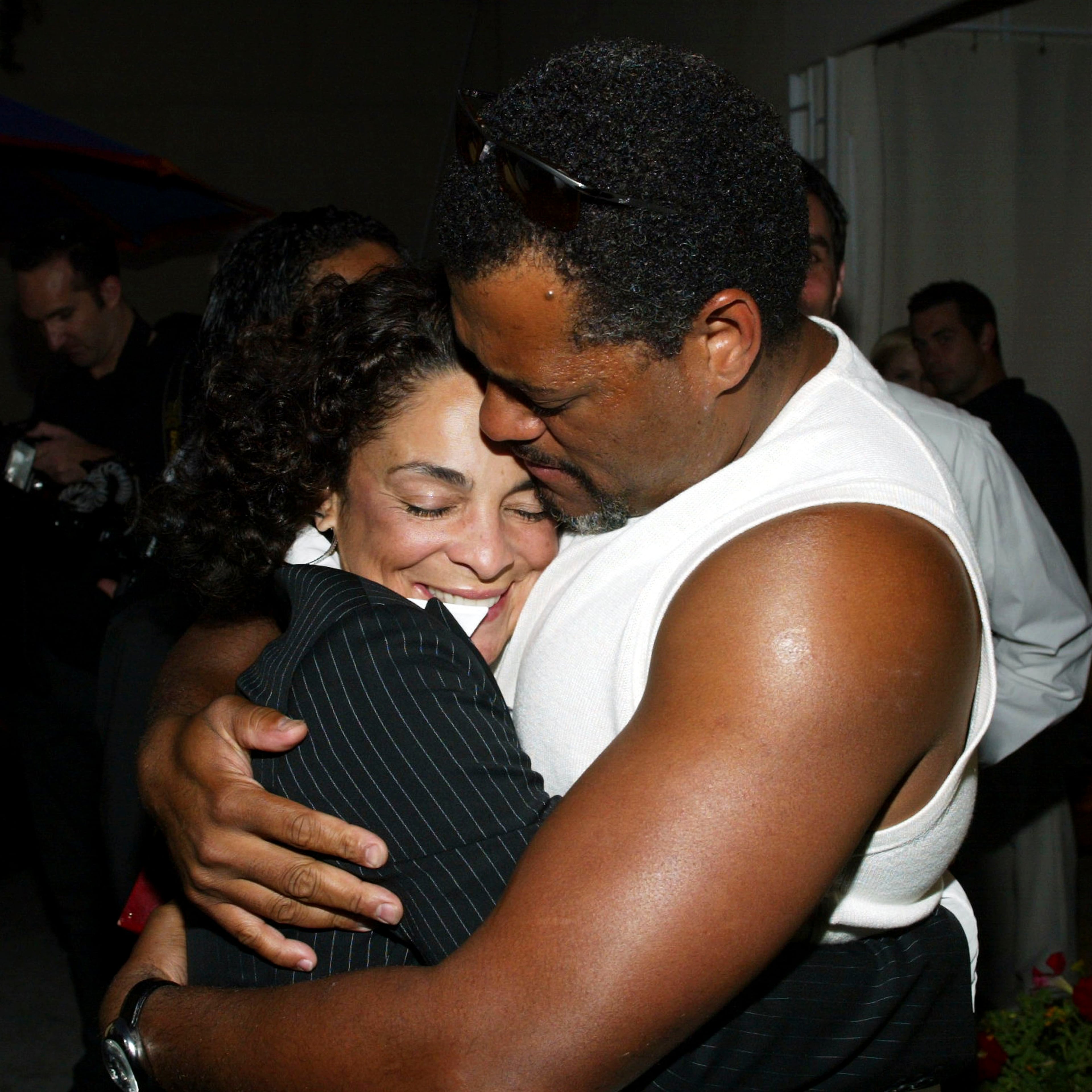 (L to R) Actors Jasmine Guy and Laurence Fishburne attend the Audi & Conde Nast "Never Follow" illumination party at the Raffles L' Ermitage that transformed the facade of Beverly Hills City Hall with a lighting design inspired by Guy Laliberte' on August 6, 2003 in Beverly Hills, California. The installation is part of "Audi: Never Follow", a landmark cultural initiative that recognizes outstanding individuals and celebrates the launch of the new 2004 Audi A8 L. (Photo by Frederick M. Brown/Getty Images)