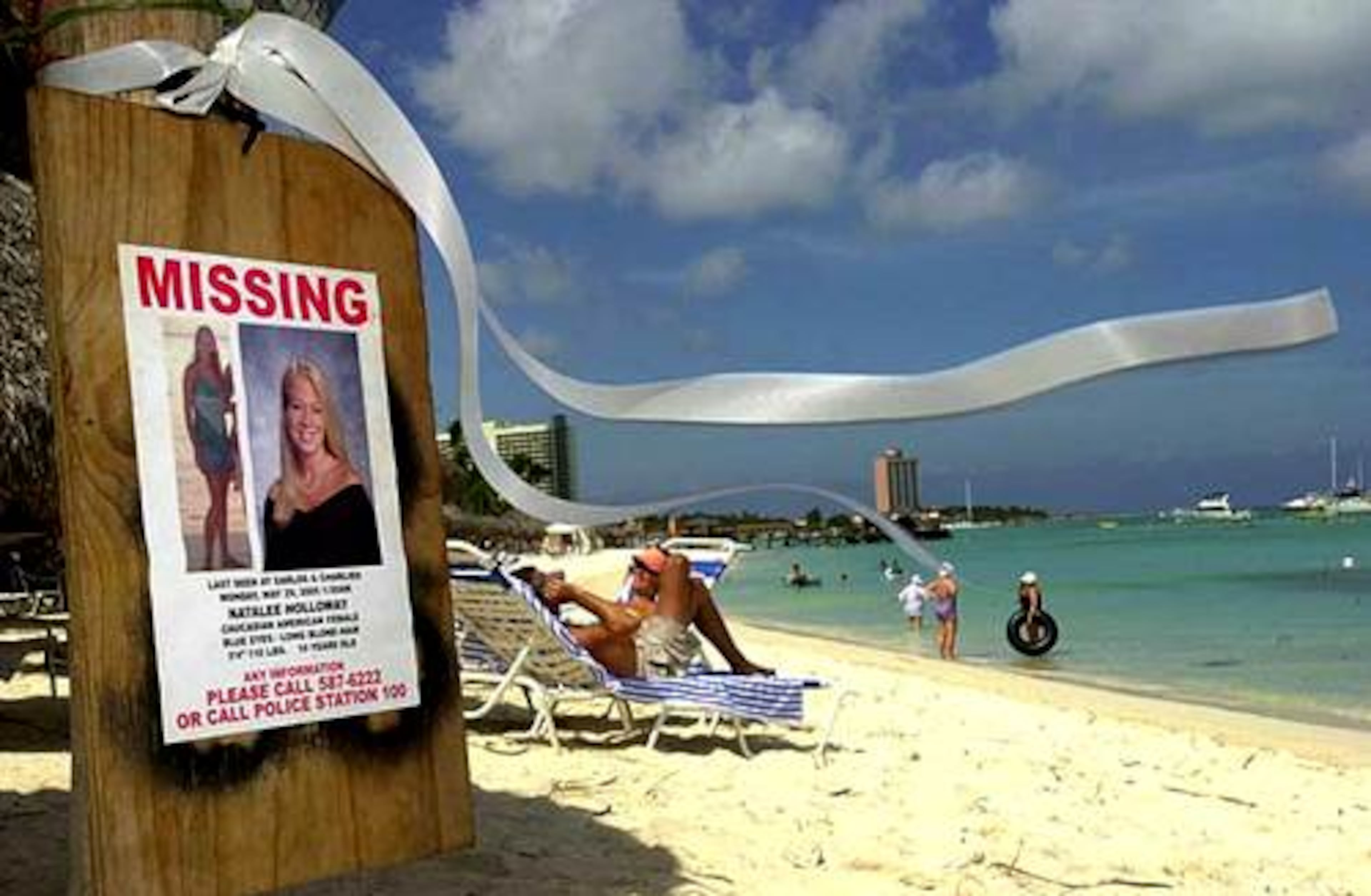 A "missing" poster for Natalee Holloway was put up near her hotel on Palm Beach, Aruba, in this June 2005 photo.