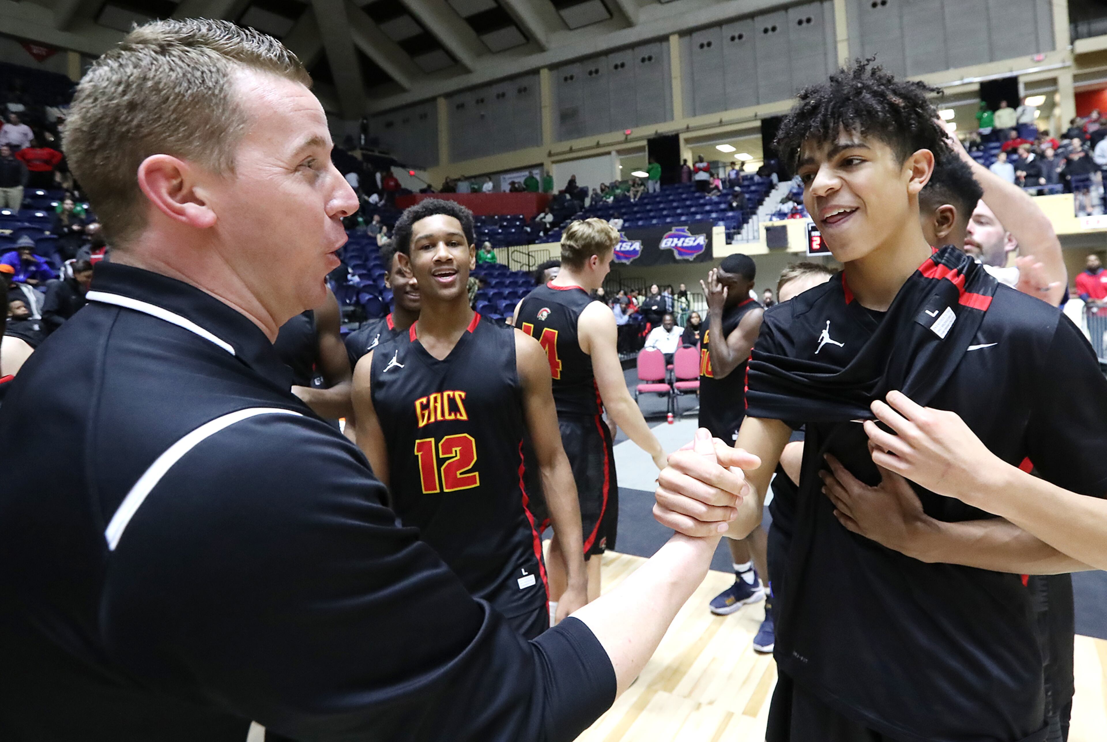 March 8, 2018 Macon: GAC head coach David Eaton gives guard Ben Sheppard five after beating Jenkins 67-53 to win their GHSA state basketball championship game on Thursday, March 8, 2018, in Macon. Curtis Compton/ccompton@ajc.com