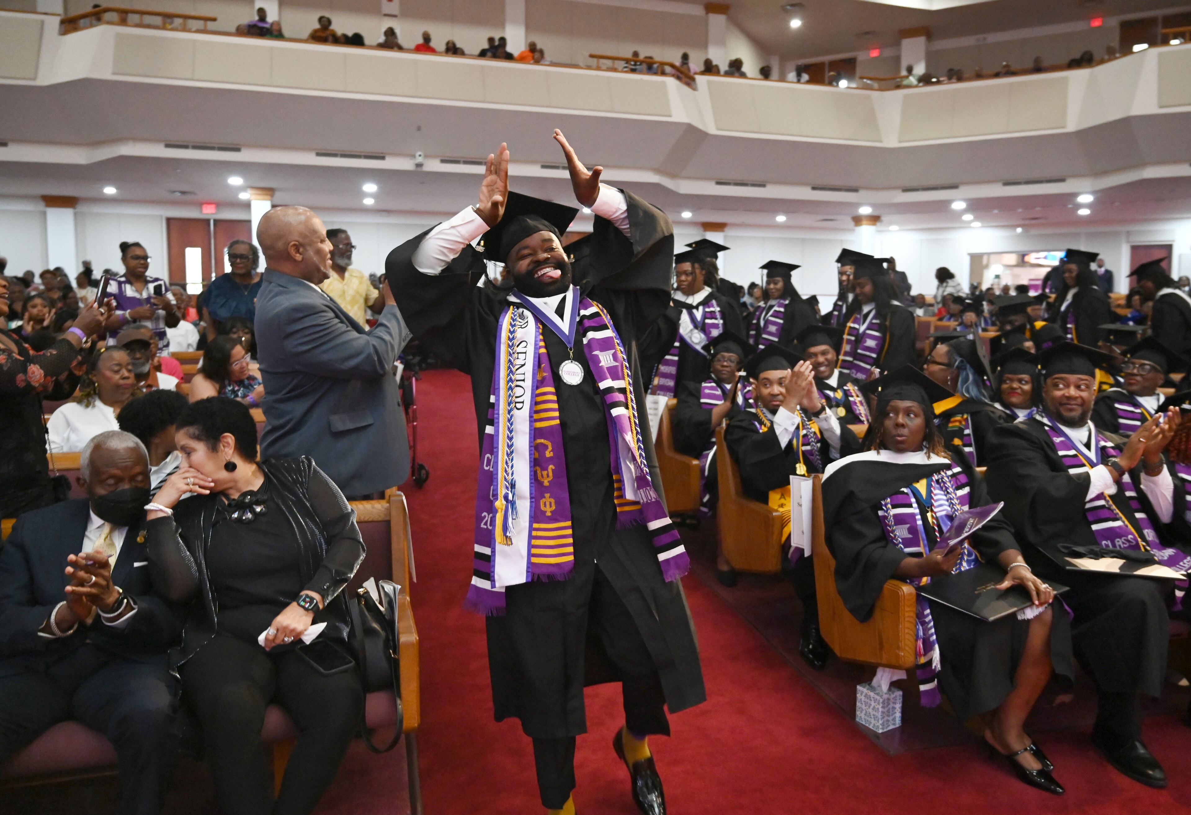 James Albritten reacts before he receives his degree during 2025 Morris Brown College commencement exercises at Saint Philip A.M.E. Church, Saturday, May 17, 2025, in Atlanta. (Hyosub Shin / AJC)