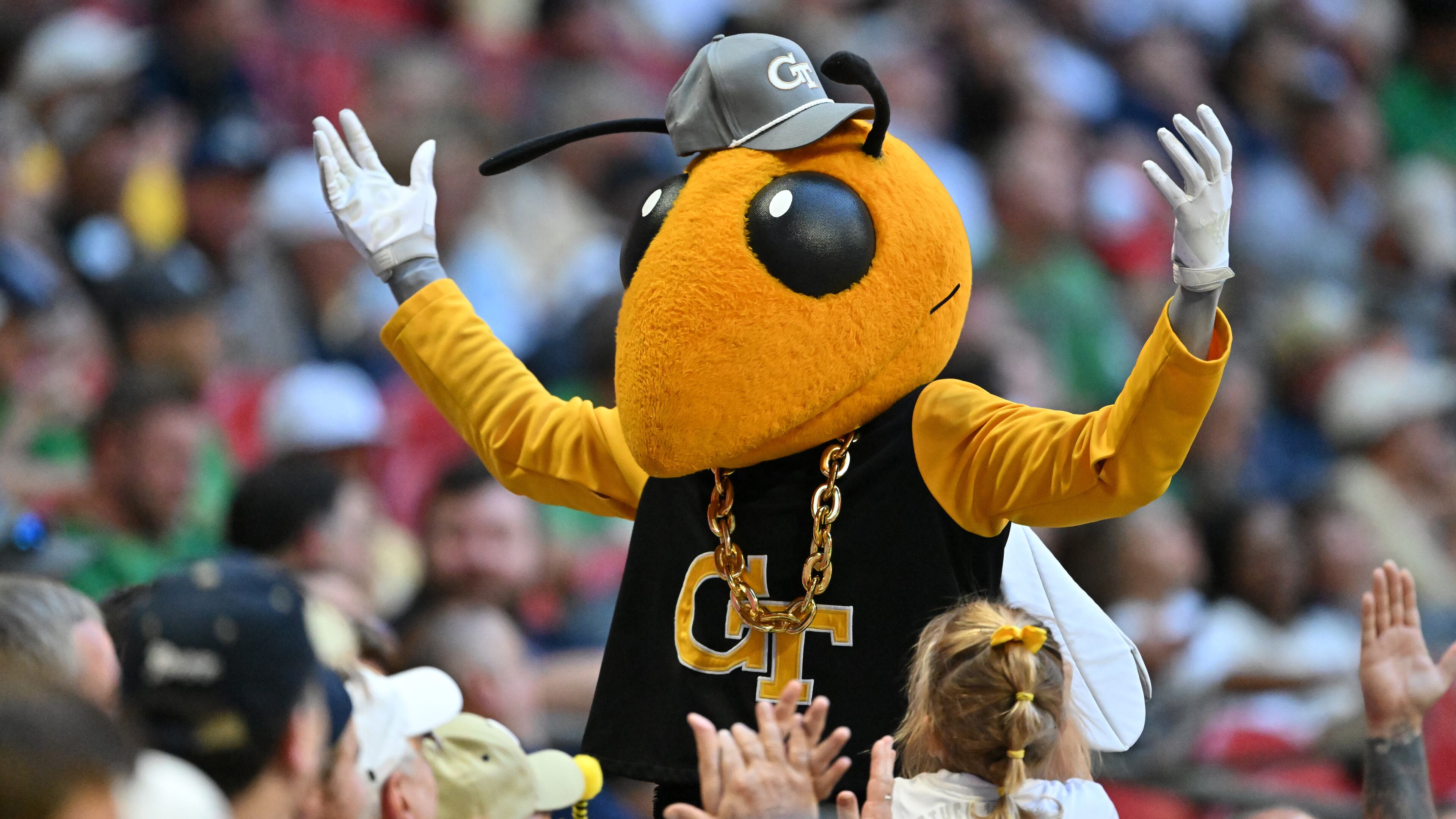 Georgia Tech mascot Buzz may have a pair of twin brothers to root on this fall, as East Coweta's Courtlin and Courtney Heard committed to play football for the Yellow Jackets. (Hyosub Shin/AJC 2024)
